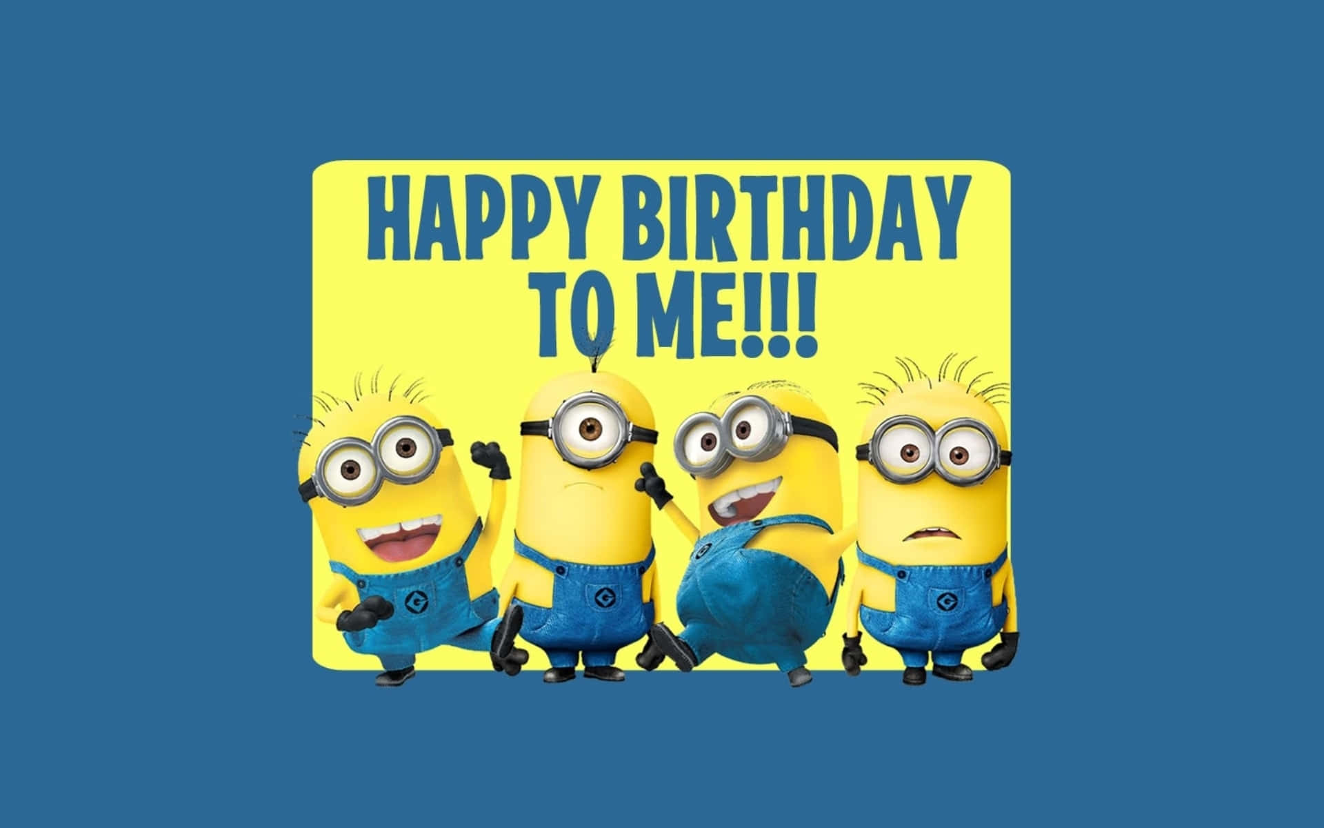 四個Minions用一個歡樂的標語牌慶祝生日。