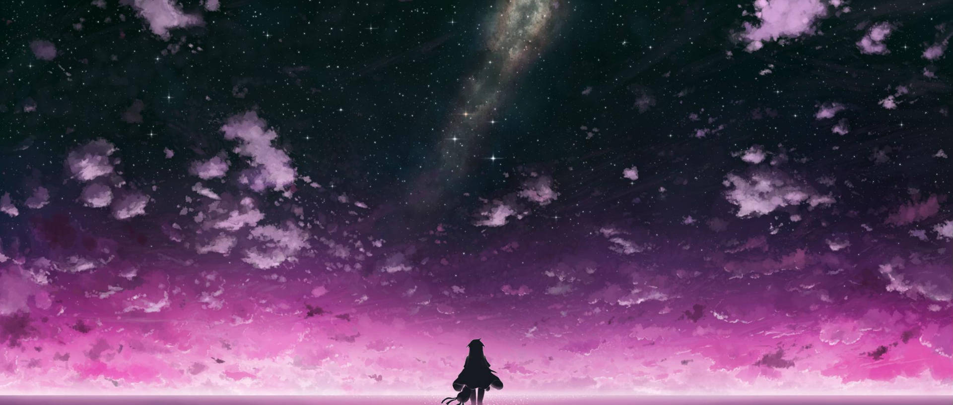 一個人仰望有發光星系的星空粉紅色和紫色天空。