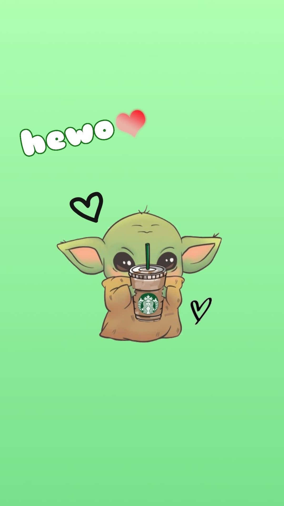 Grogu拿著一個星巴克杯子，上面有心形和「hewo」文字，背景為綠色。