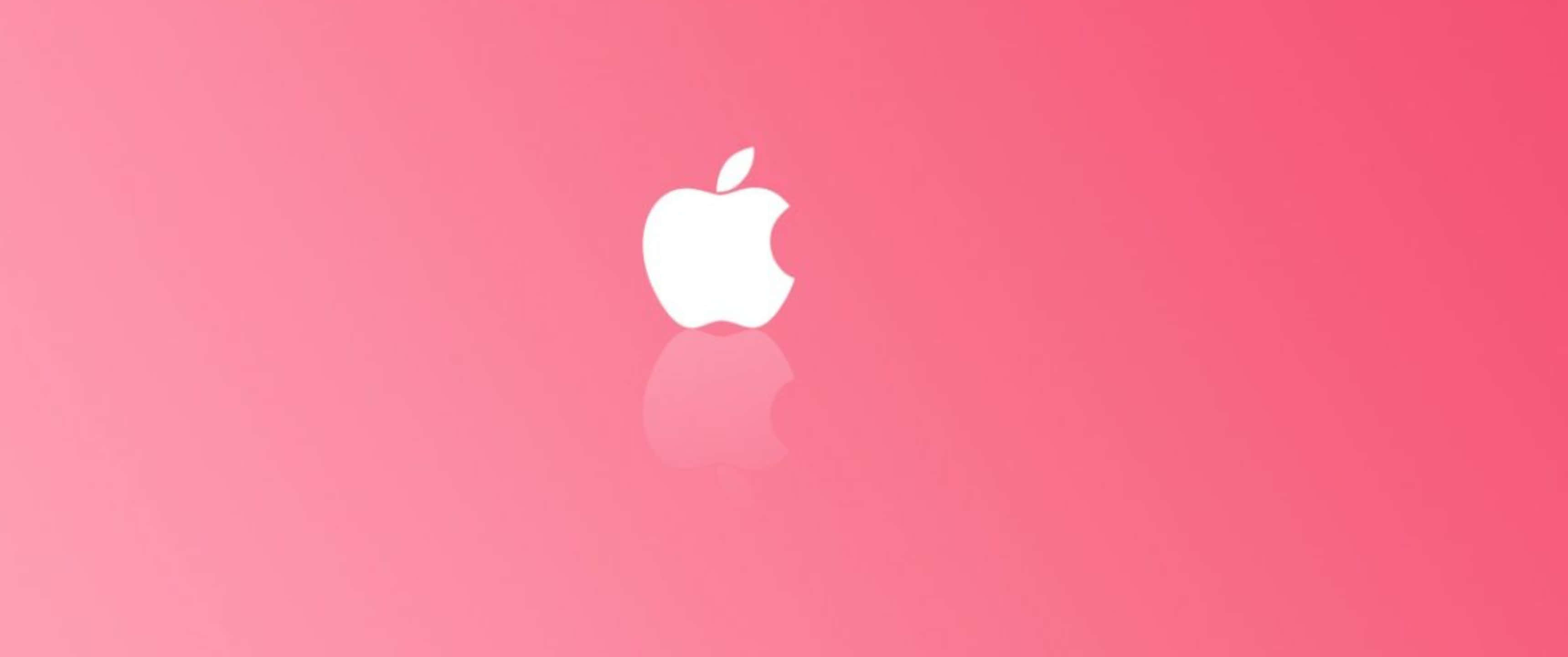 展現柔美粉紅與可愛設計的精緻美感 壁紙 — 一個簡約的白色Apple標誌，帶有咬痕和倒影，居中在漸變粉紅色背景上。