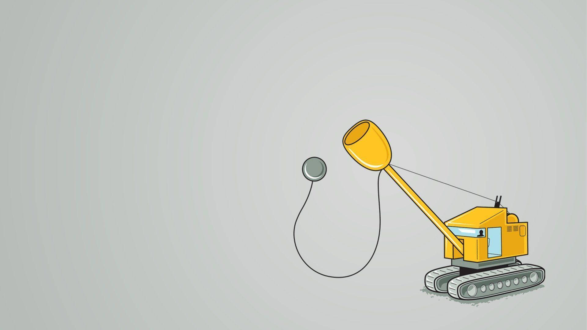 黃色卡通挖掘機用繩子懸掛一個銀色球。