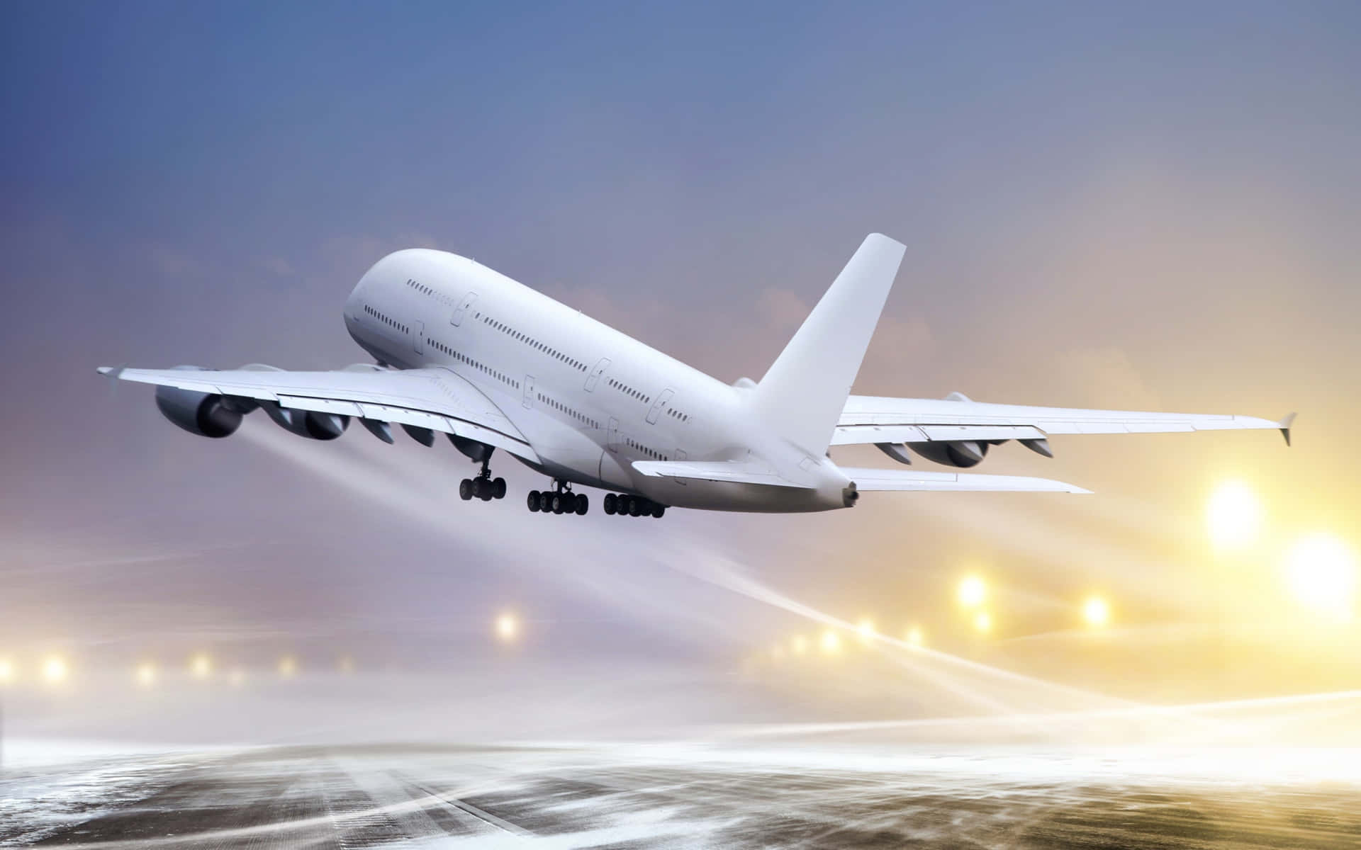 白色空中巴士A380飛機在日落時分起飛，下方跑道燈閃閃發光。