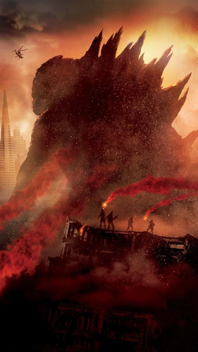 Godzilla 2014 桌布 壁紙 — 巨大的哥斯拉聳立在燃燒的城市上空，小小的士兵站在被毀的車輛上，面對著火紅的橙色天空，表現出挑釁的姿態。
