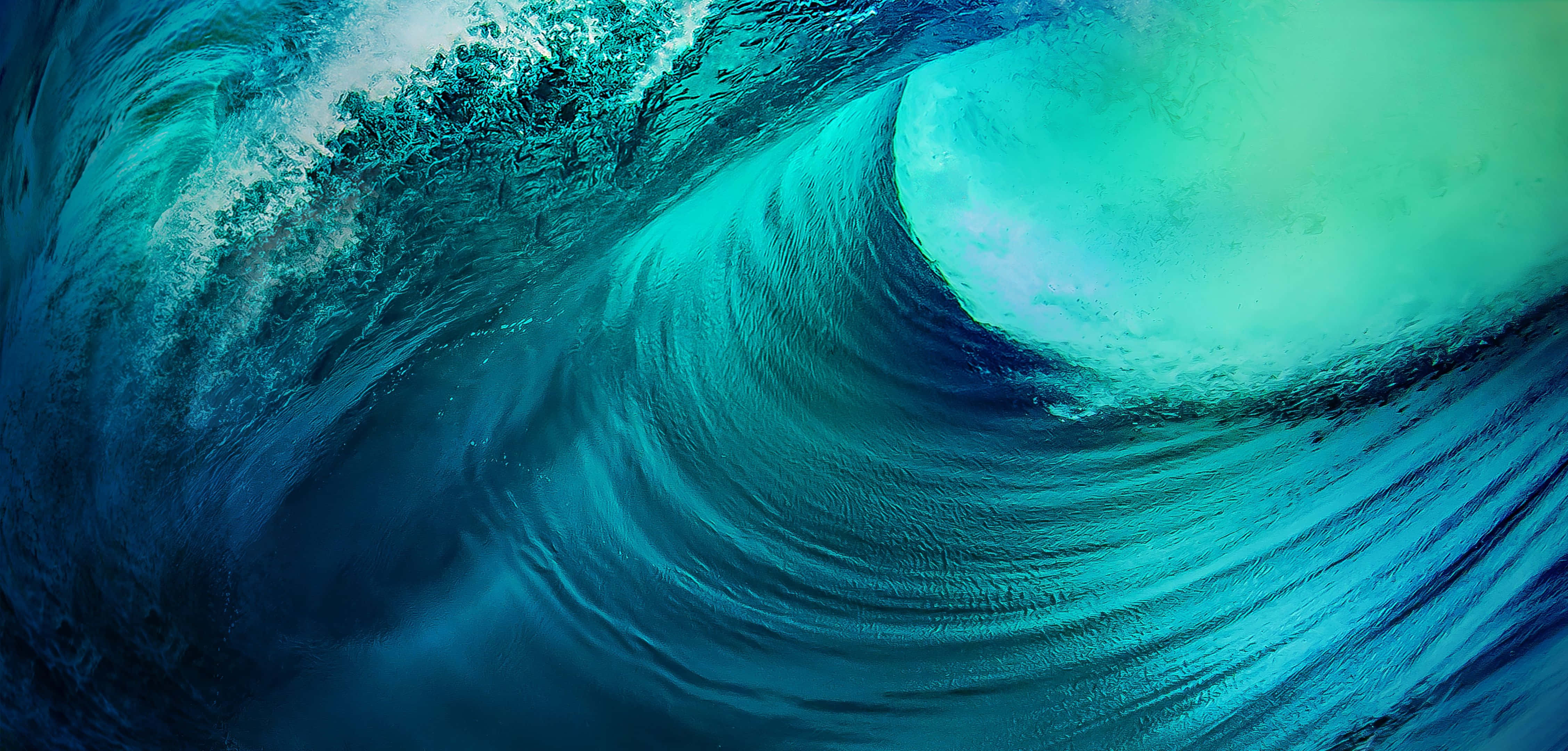 waves 桌布 壁紙 — 巨大的藍綠色海浪捲成完美的筒狀，在深藍色海水中激起白色泡沫飛濺。