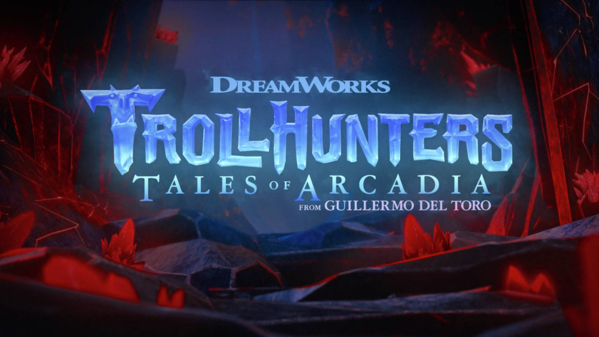 在黑暗洞穴中，帶有紅色照明和岩石地形的發光藍色「Troll Hunters」標題。