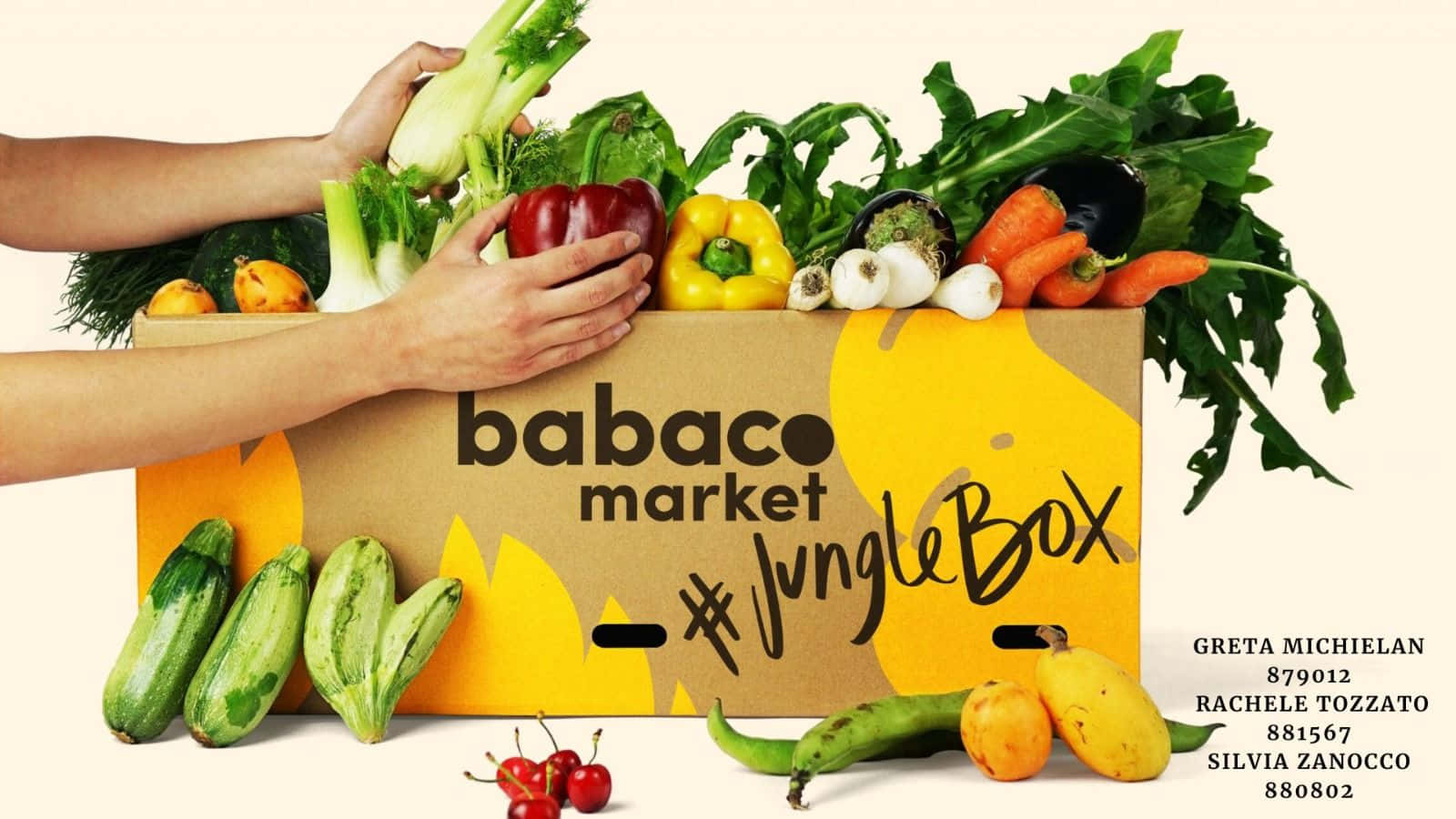 雙手從標有JungleBox的品牌紙箱中抓取新鮮蔬菜。