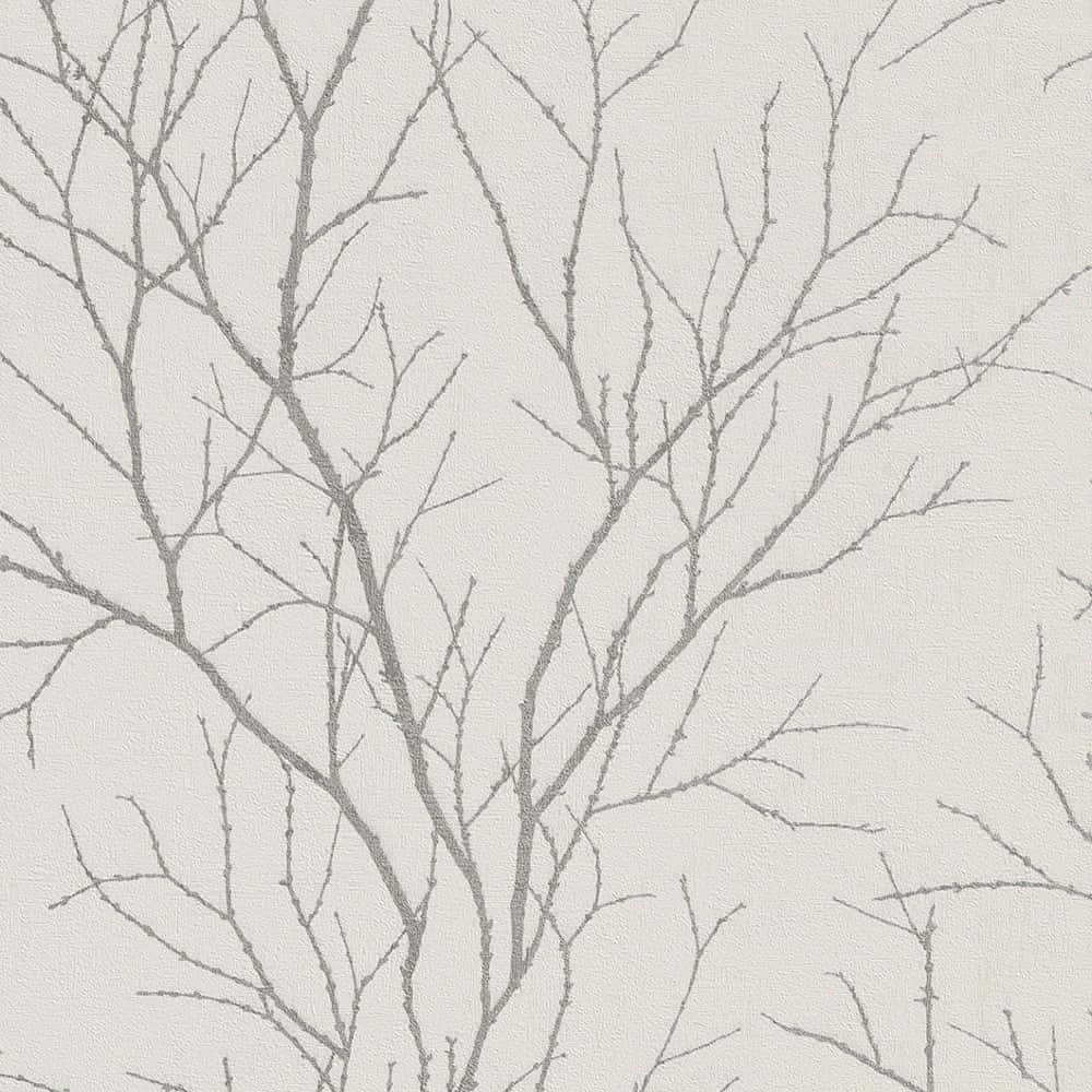 帶有紋理的米白色背景上的灰色光禿樹枝。