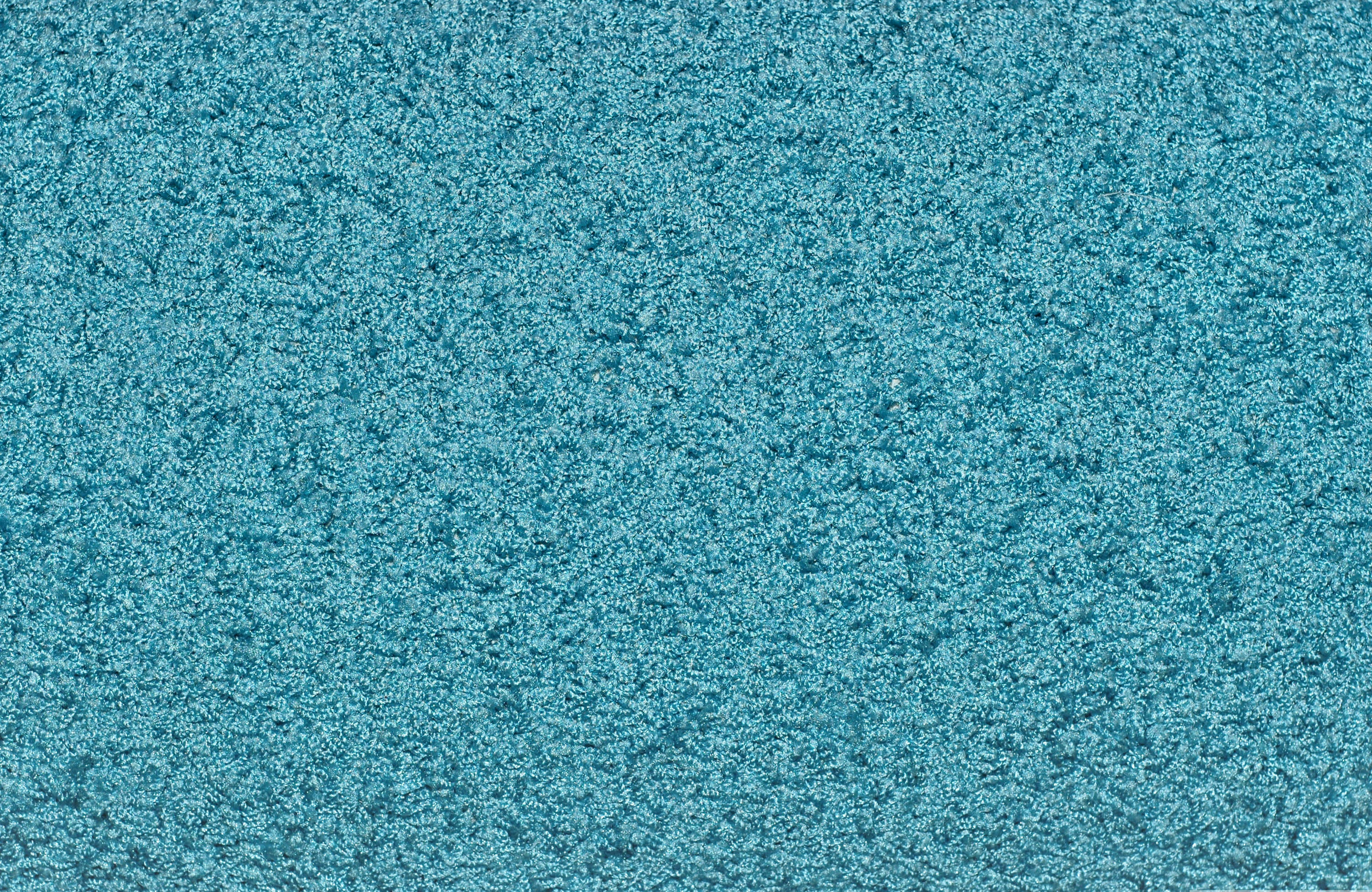Carpet Texture 桌布 壁紙 — 帶有柔軟纖維和細微顏色變化的質感青綠色地毯特寫。