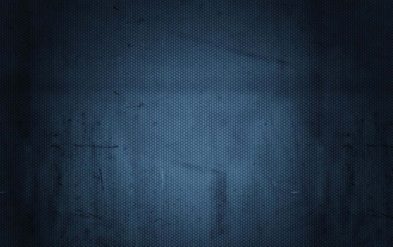 帶有灰調的午夜藍質感背景 壁紙 — 深藍色六角形網格紋理，帶有微妙的漸變和粗糙表面上的輕微刮痕。