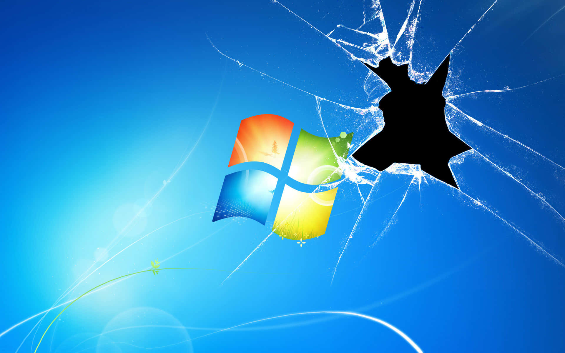 Windows 標誌在藍色背景上透過破碎玻璃效果顯示。