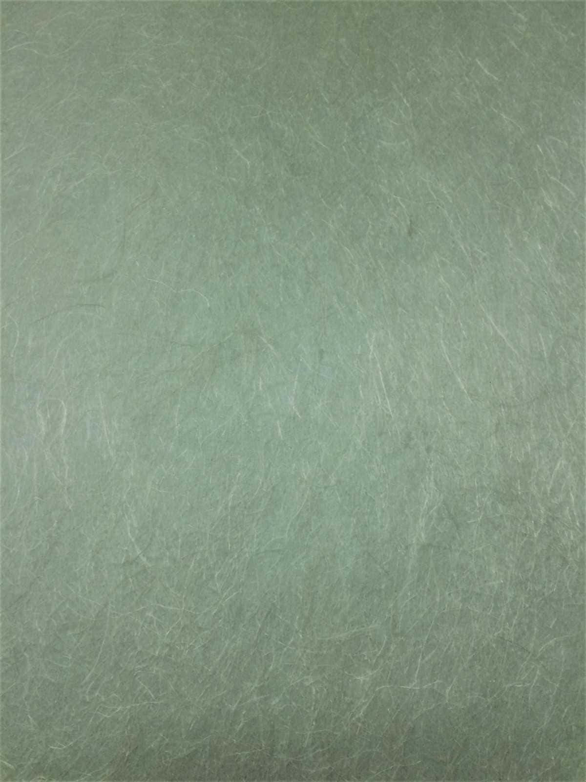 sage green aesthetic 桌布 壁紙 — 帶有細微纖維圖案和柔和漸變陰影的紋理綠色紙張特寫。