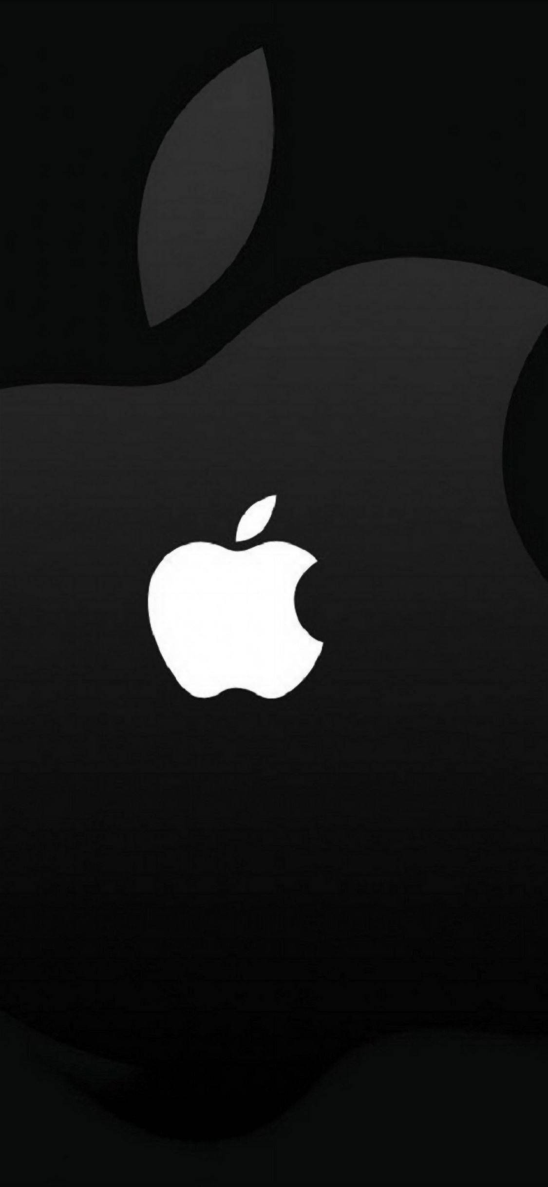 帶有蘋果標誌的簡約黑色iPhone 壁紙 — 一張極簡黑色桌布，中央有一個發光的白色Apple標誌，背景為微妙的深色紋理。