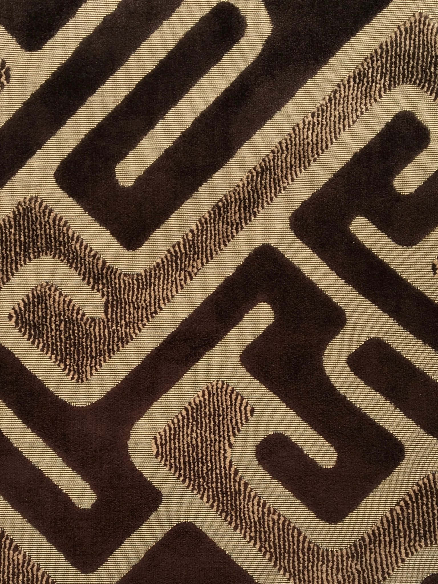 Brown Geometric 桌布 壁紙 — 帶有鮮明棱角形狀的紋理棕色和米色幾何圖案布料的特寫。