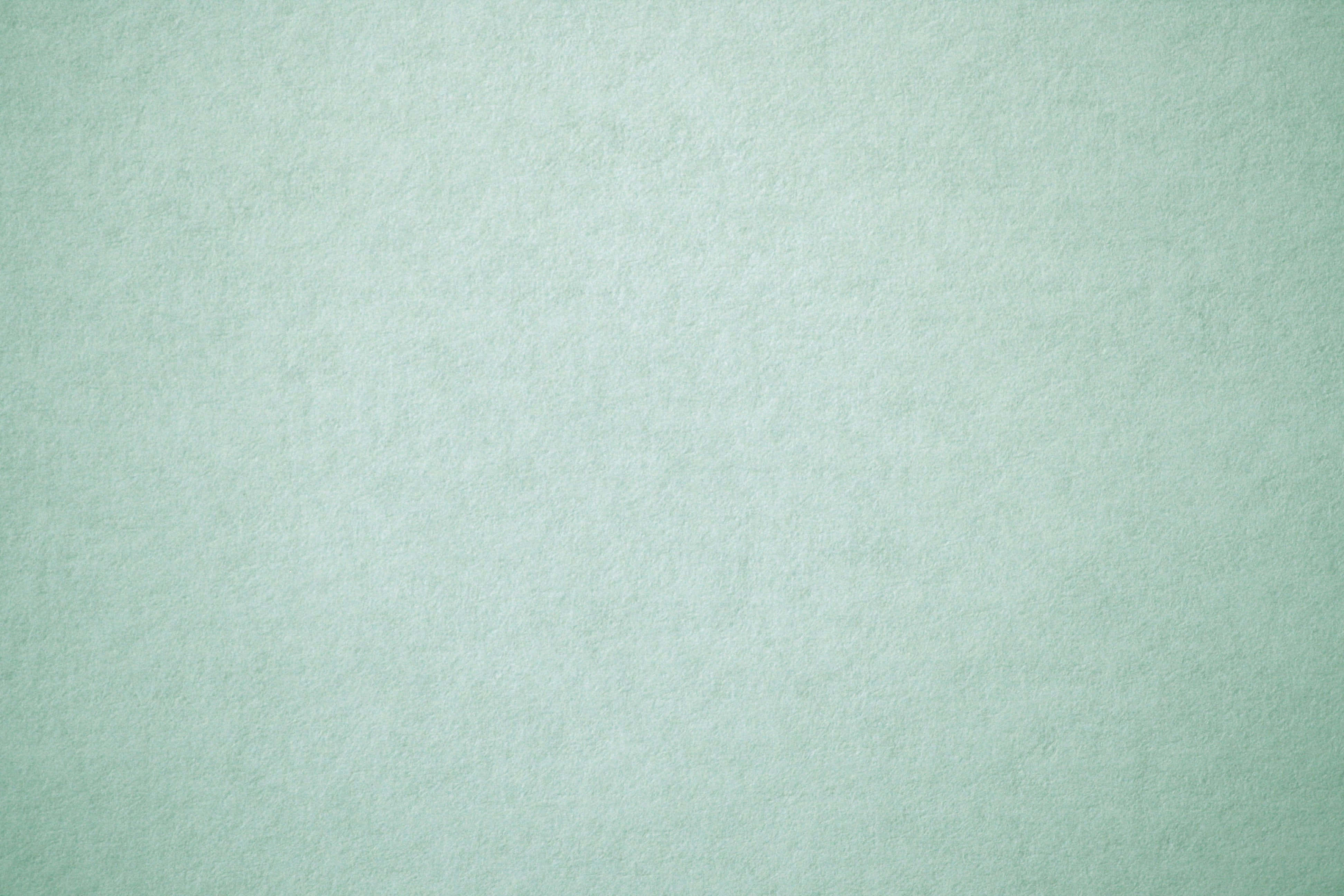 sage green aesthetic 桌布 壁紙 — 平滑薄荷綠色紋理表面，帶有細微顆粒和均勻光線。