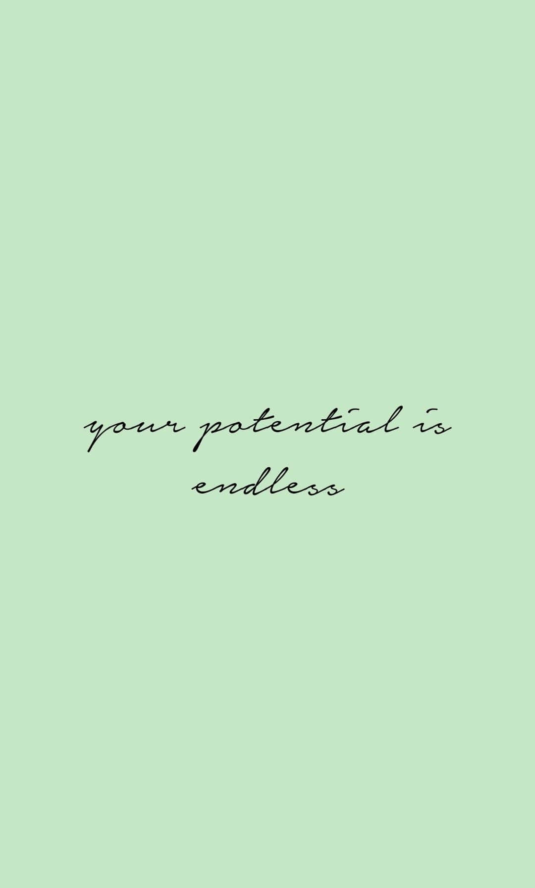 文字牆紙，在薄荷綠色背景上以黑色草書寫著 your potential is endless