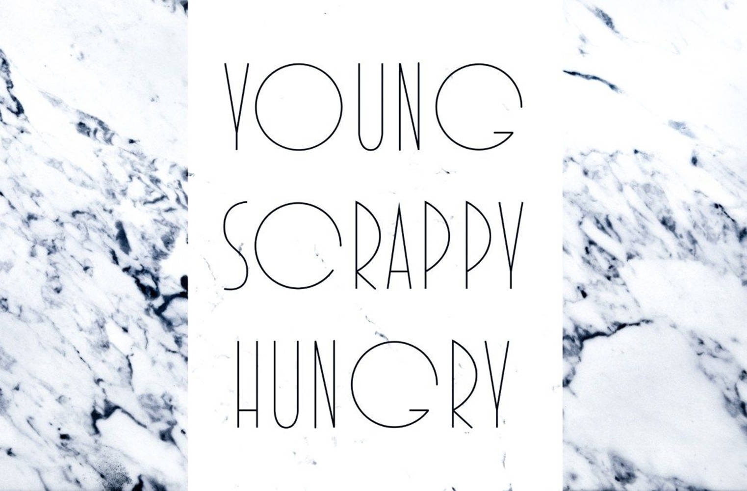 在白色大理石背景上寫著young scrappy hungry的文字。