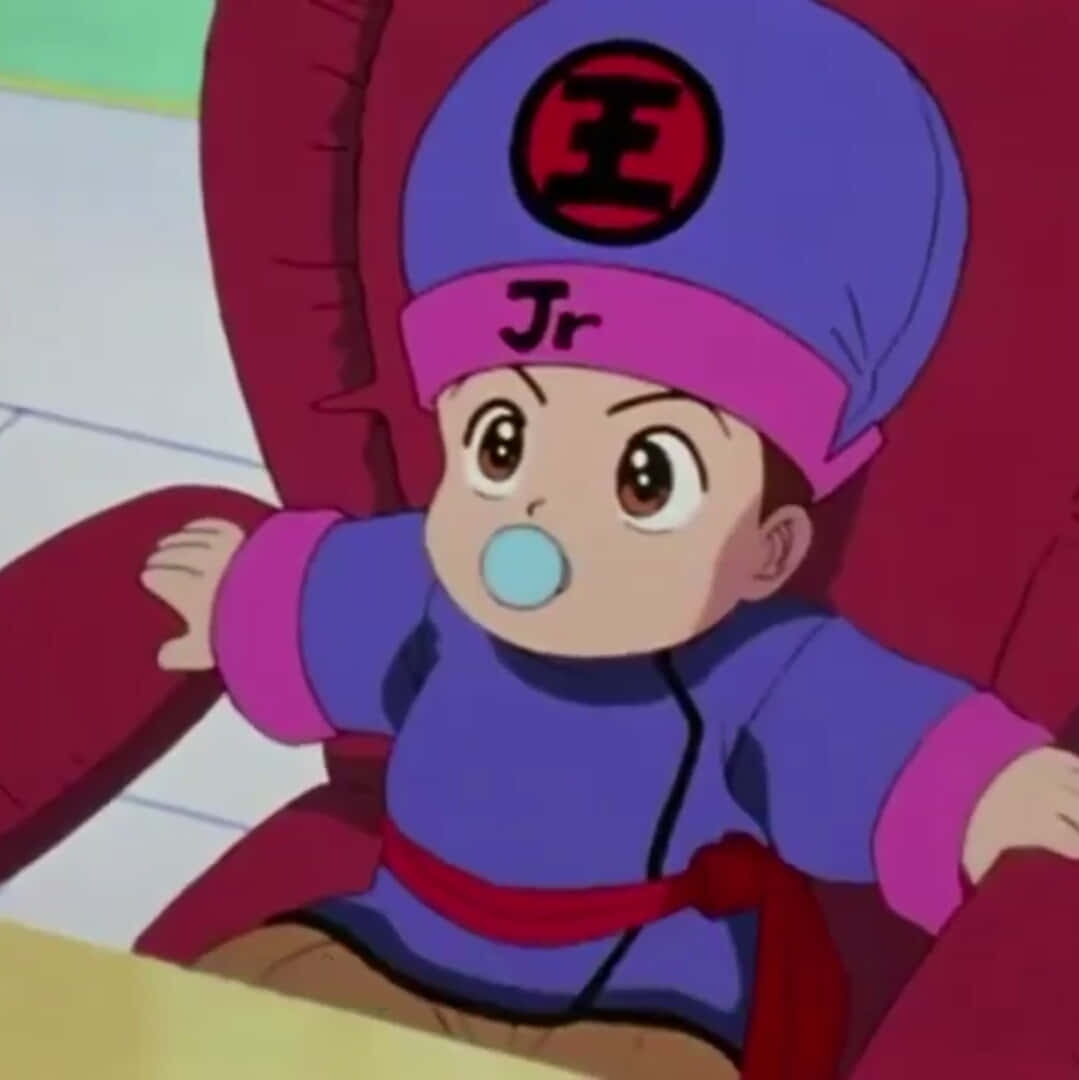坐在紅色椅子上吹泡泡的動漫嬰兒。