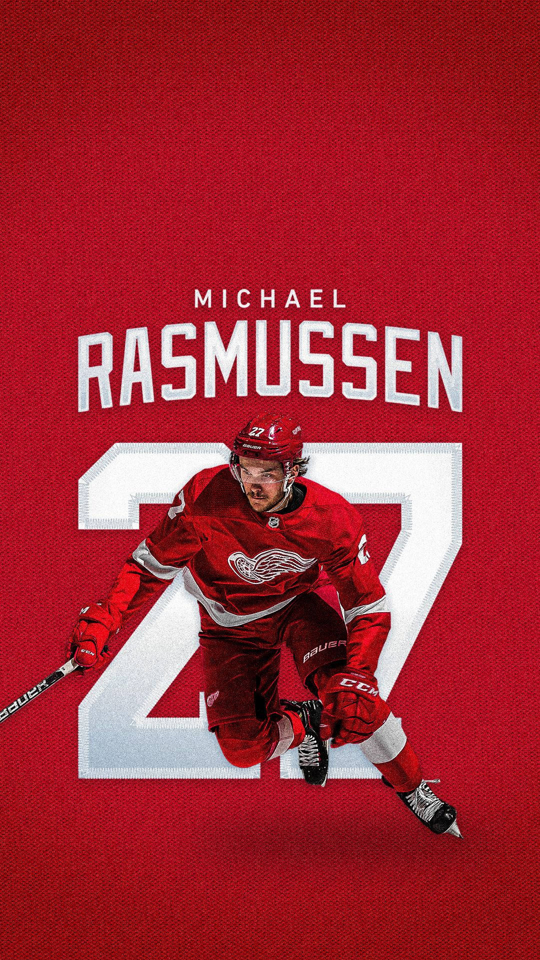 底特律紅翼隊邁克爾·拉斯穆森 壁紙 — 冰球運動員 Michael Rasmussen 身穿紅色球衣，在鮮紅色背景上動態滑行，背號27。