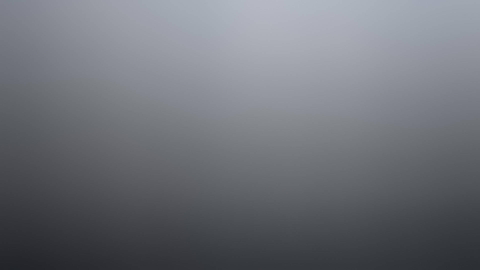 用於設計的平滑灰色到炭灰色漸變背景。