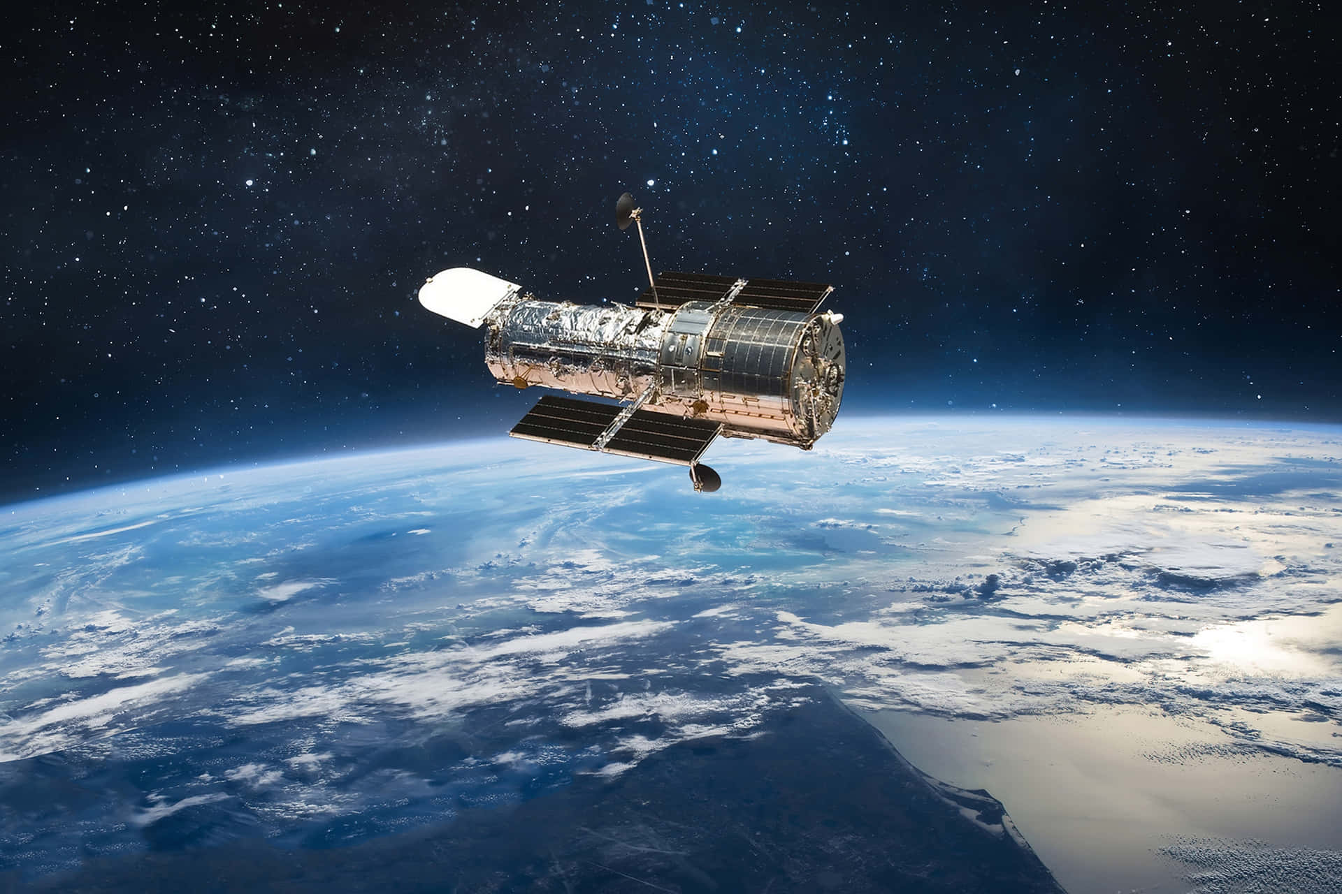 哈勃太空望遠鏡漂浮在地球上空，背景有星星。