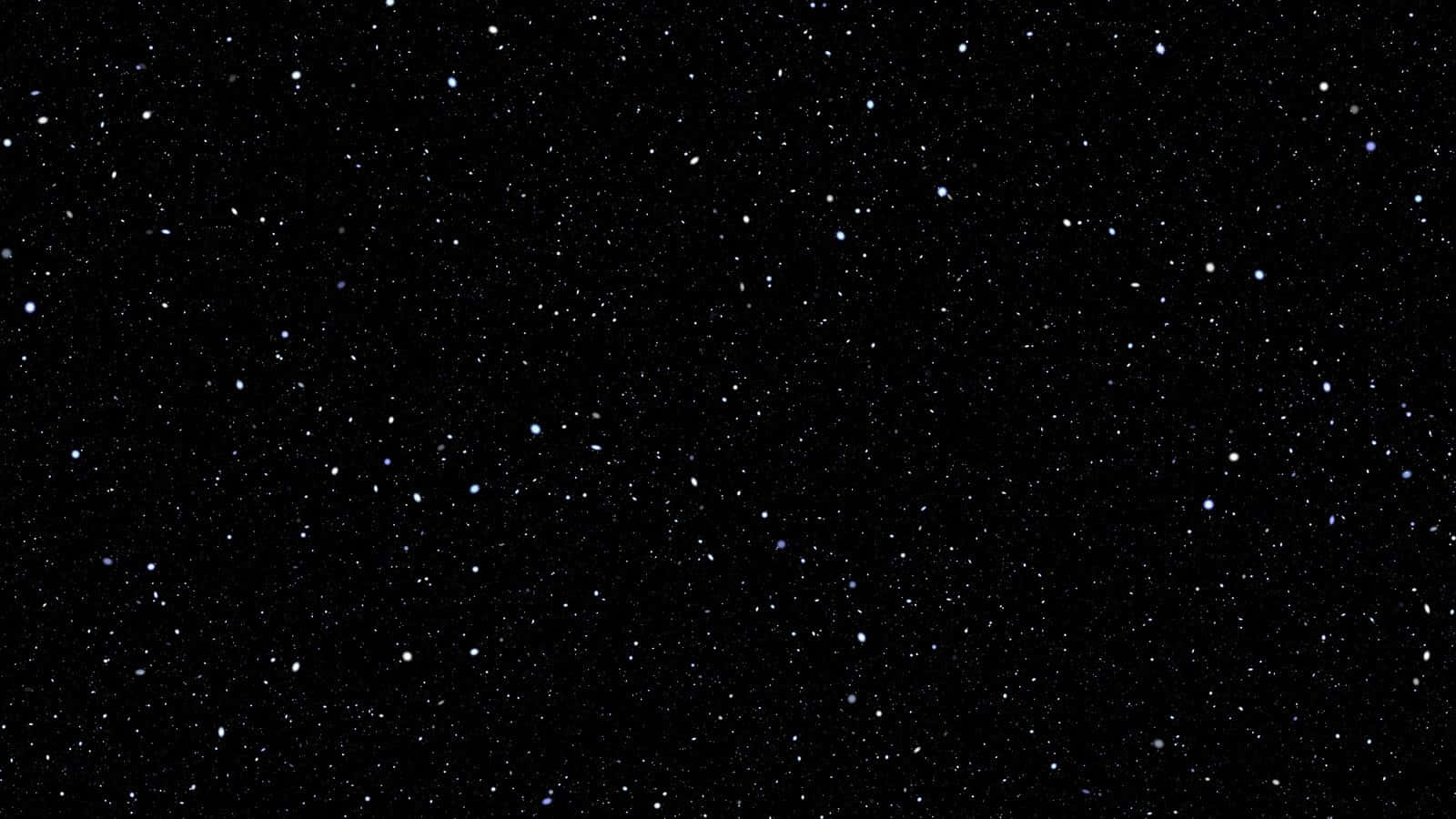 Beautiful Star 桌布 壁紙 — 廣闊深邃的黑色夜空，點綴著無數閃爍的星星和微弱的星雲。