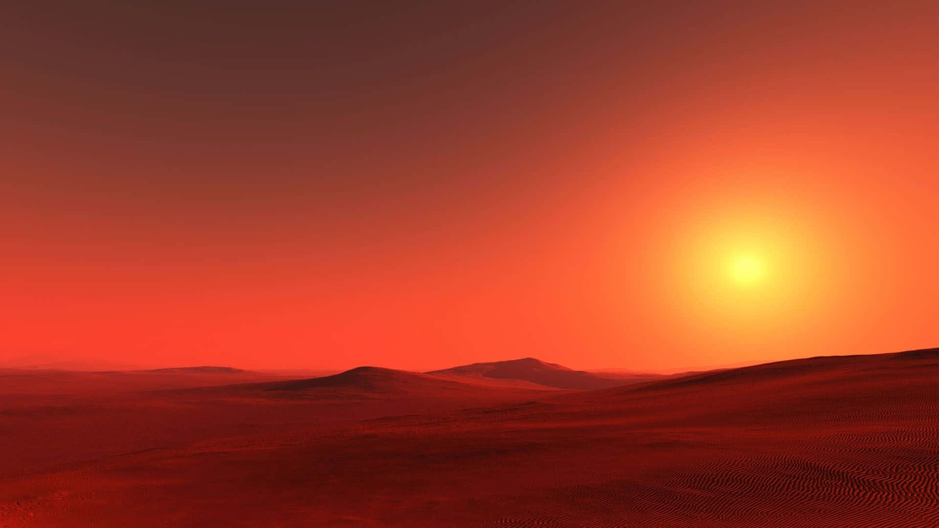 Red Sunset 桌布 壁紙 — 廣闊的沙漠景觀，在夕陽西下時沐浴在火熱的橙色和紅色色調中。