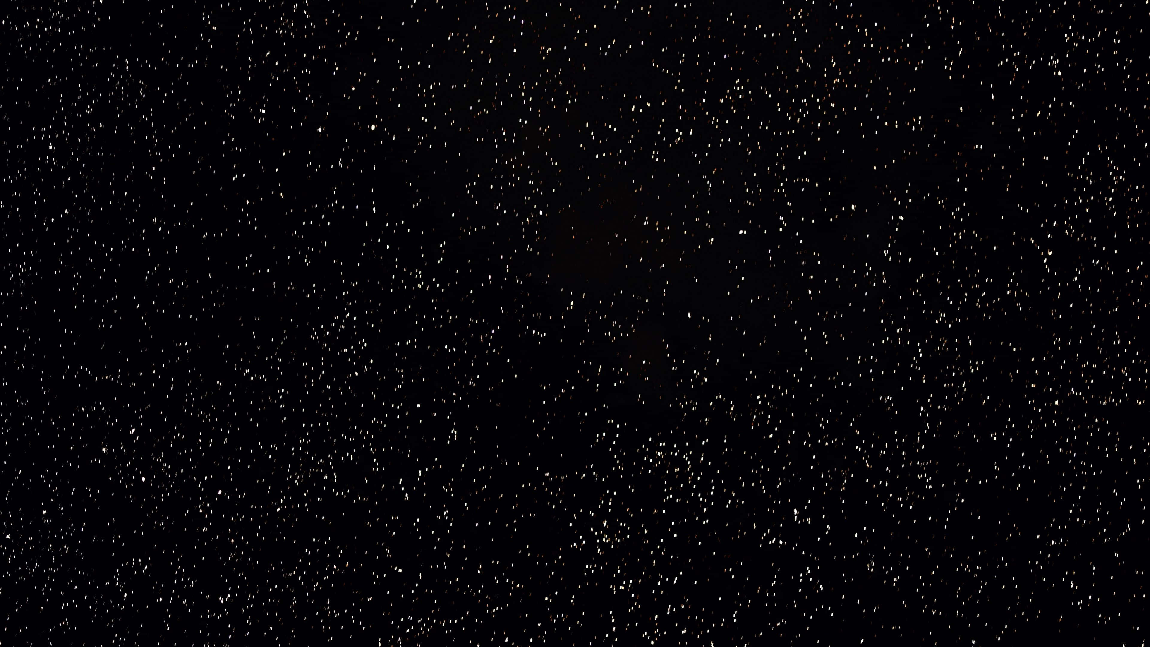 4K 黑色 桌布 壁紙 — 廣闊的黑色天空中充滿了無數閃爍的星星，營造出寧靜的宇宙場景。