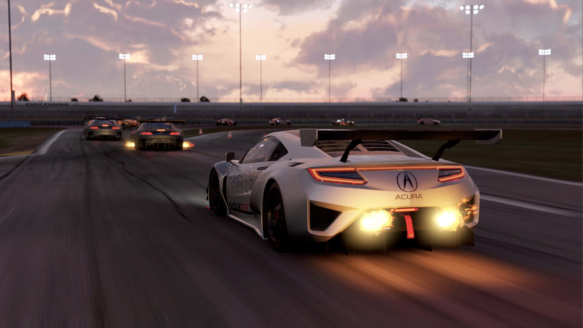 引擎轟鳴！HD Project Cars 2 帶來真實賽車體驗 壁紙 — 一輛白色Acura賽車在黃昏時分帶著發光的尾燈在賽道上飛馳，其他賽車在體育場燈光下領先。