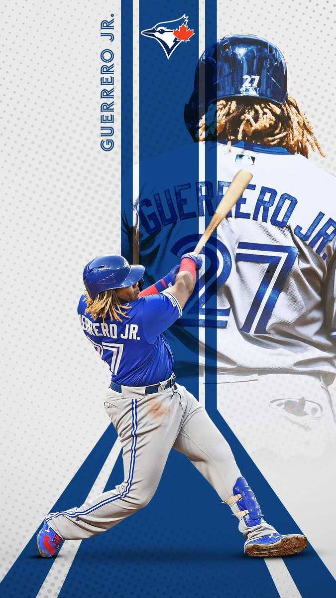 身穿藍白球衣的棒球手 Guerrero Jr. 揮棒。