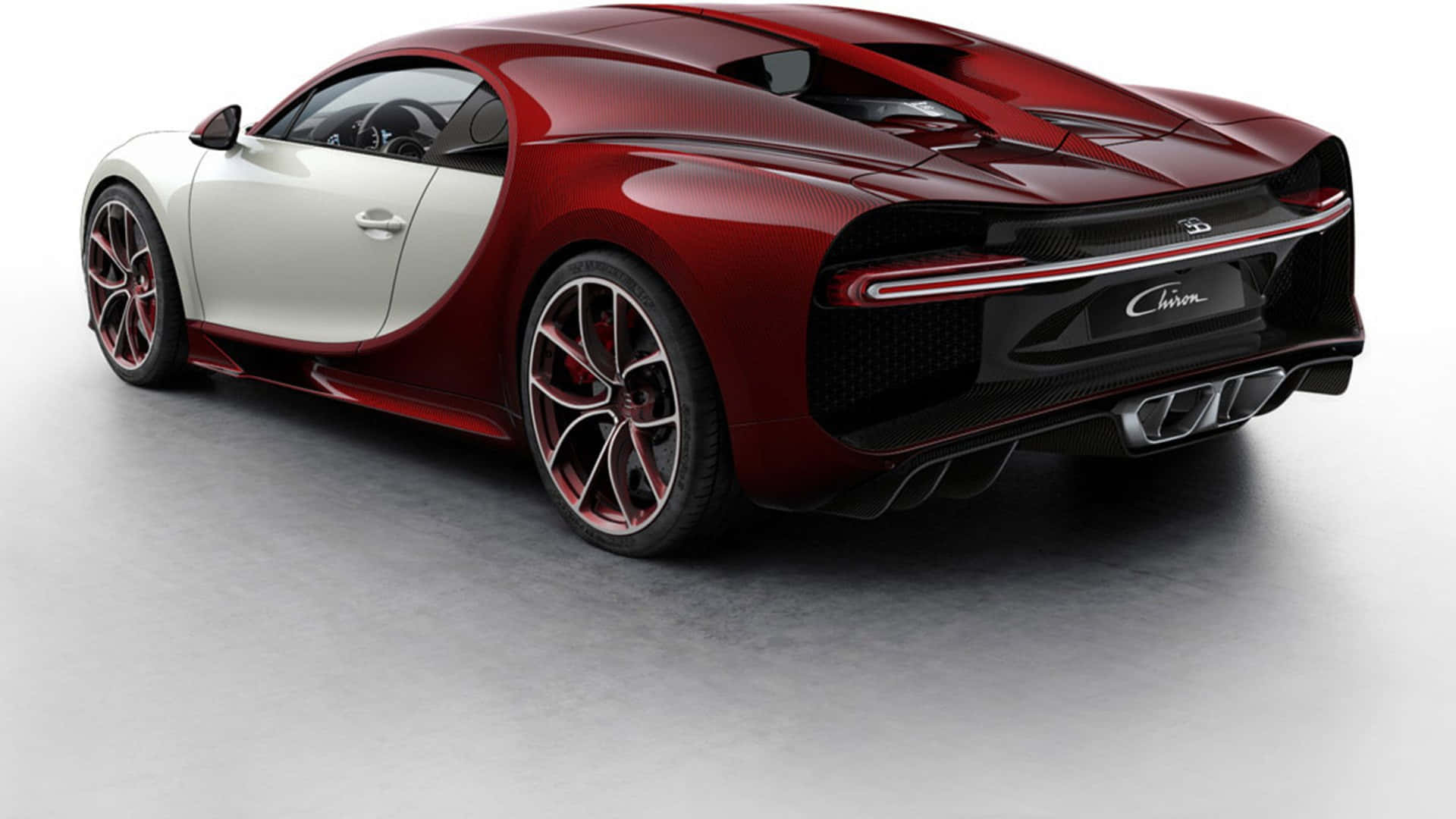 工作室中的紅白 Bugatti Chiron 跑車，帶有發光尾燈。