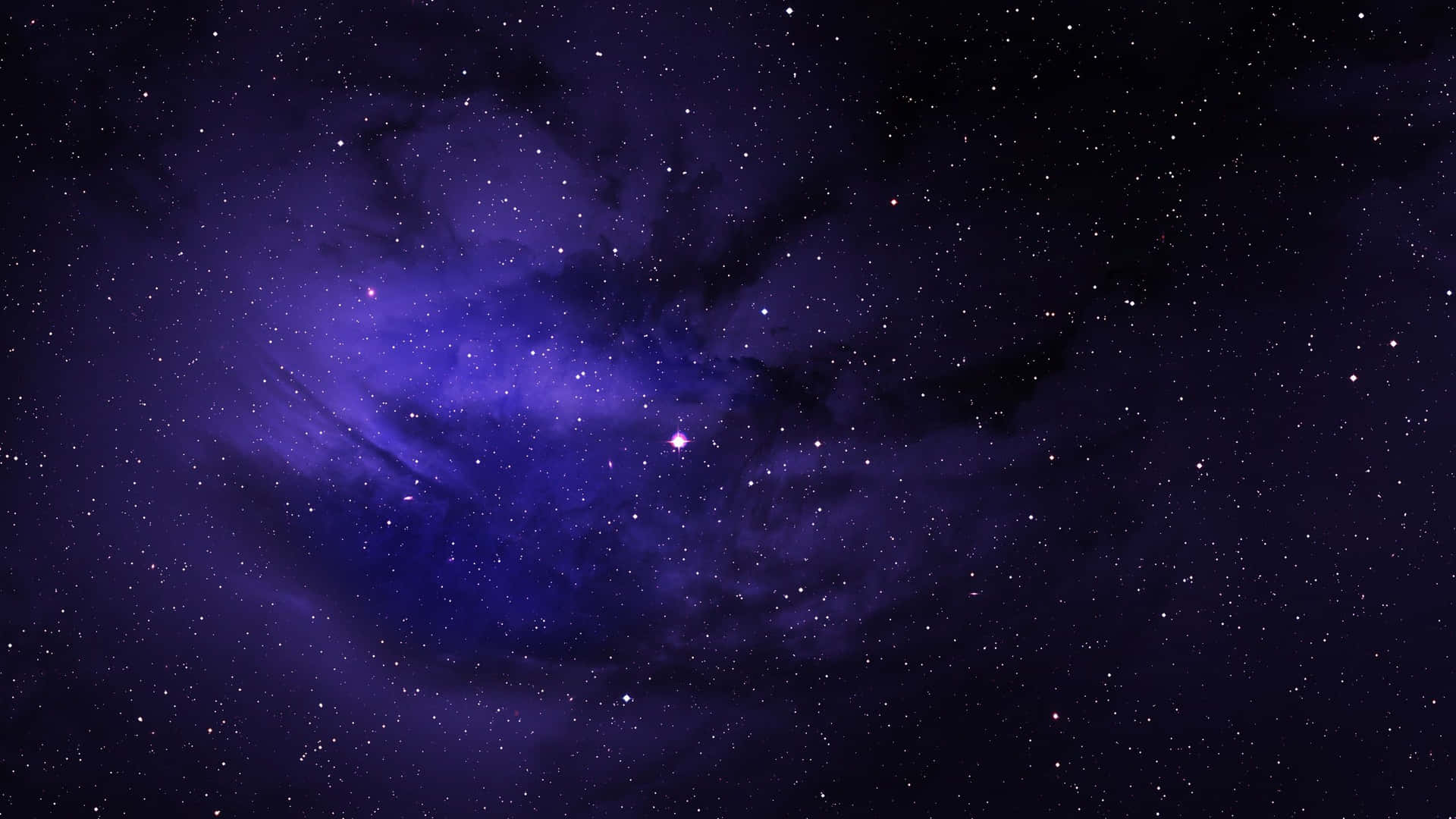 深空中充滿恆星的紫色星雲。