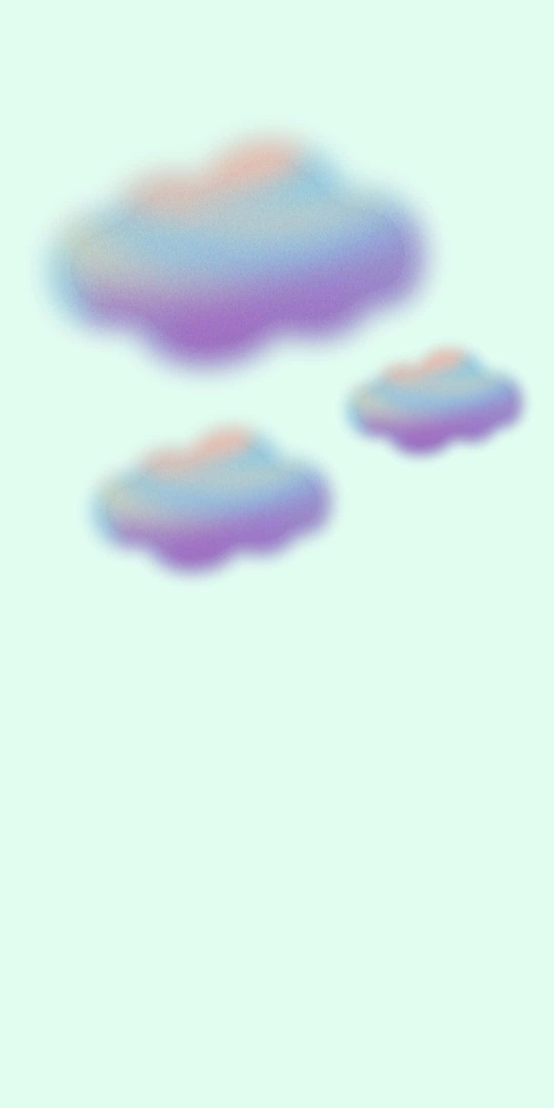 彩色棉花糖雲朵極光背景 壁紙 — 三朵柔和的粉彩雲，帶有粉紅、紫色和藍色漸變，在淡薄荷綠的天空中輕輕飄浮。