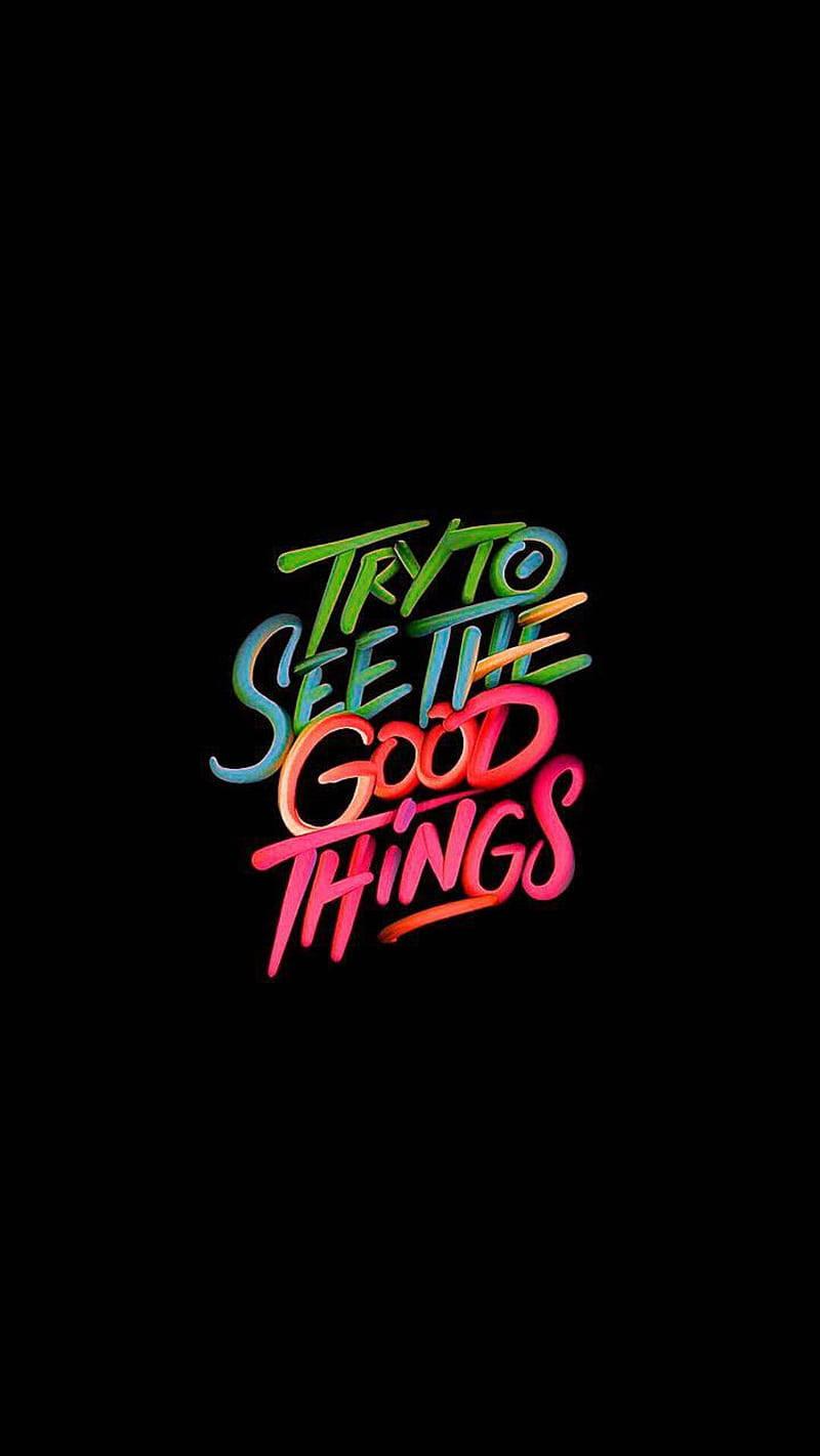 彩色語錄深色背景 壁紙 — 鮮豔的霓虹色風格文字「TRY TO SEE THE GOOD THINGS」在純黑色背景上發光。