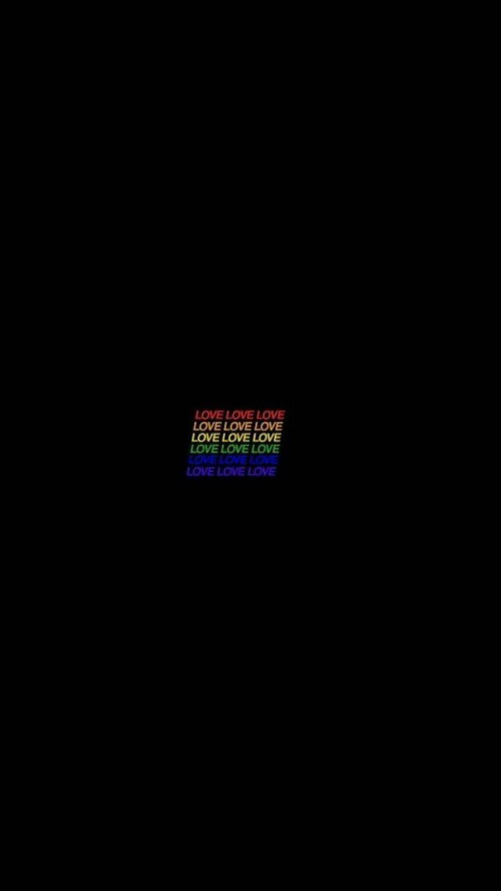 彩虹漸變文字在黑色背景上重複love一詞。