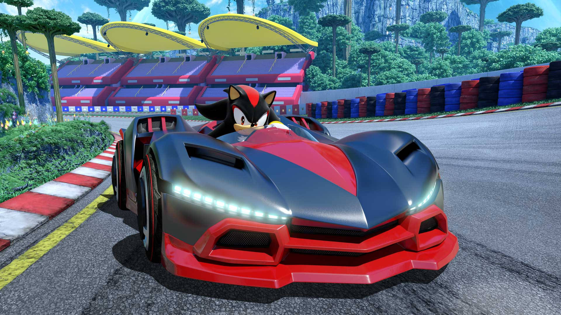影子刺猬駕駛紅色賽車 壁紙 — Shadow the Hedgehog 駕駛著一輛時尚的紅黑色跑車，在充滿活力的熱帶賽道上奔馳。