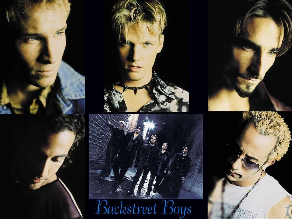 Backstreet Boys 樂隊成員在戲劇性的工作室肖像中，背景陰暗，光線強烈。