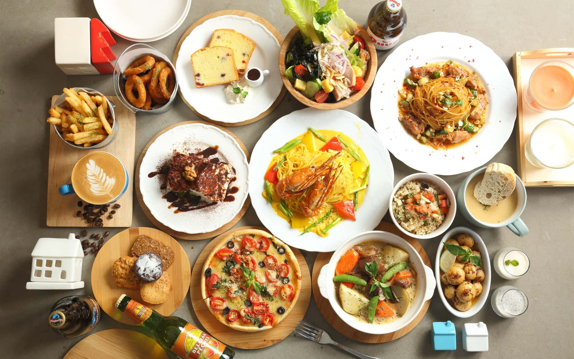 Food And Beverage 桌布 壁紙 — 從上方俯瞰，一張中性色調的桌子上擺滿了各種充滿活力的環球美食，包括意粉、薄餅、沙律和甜品。