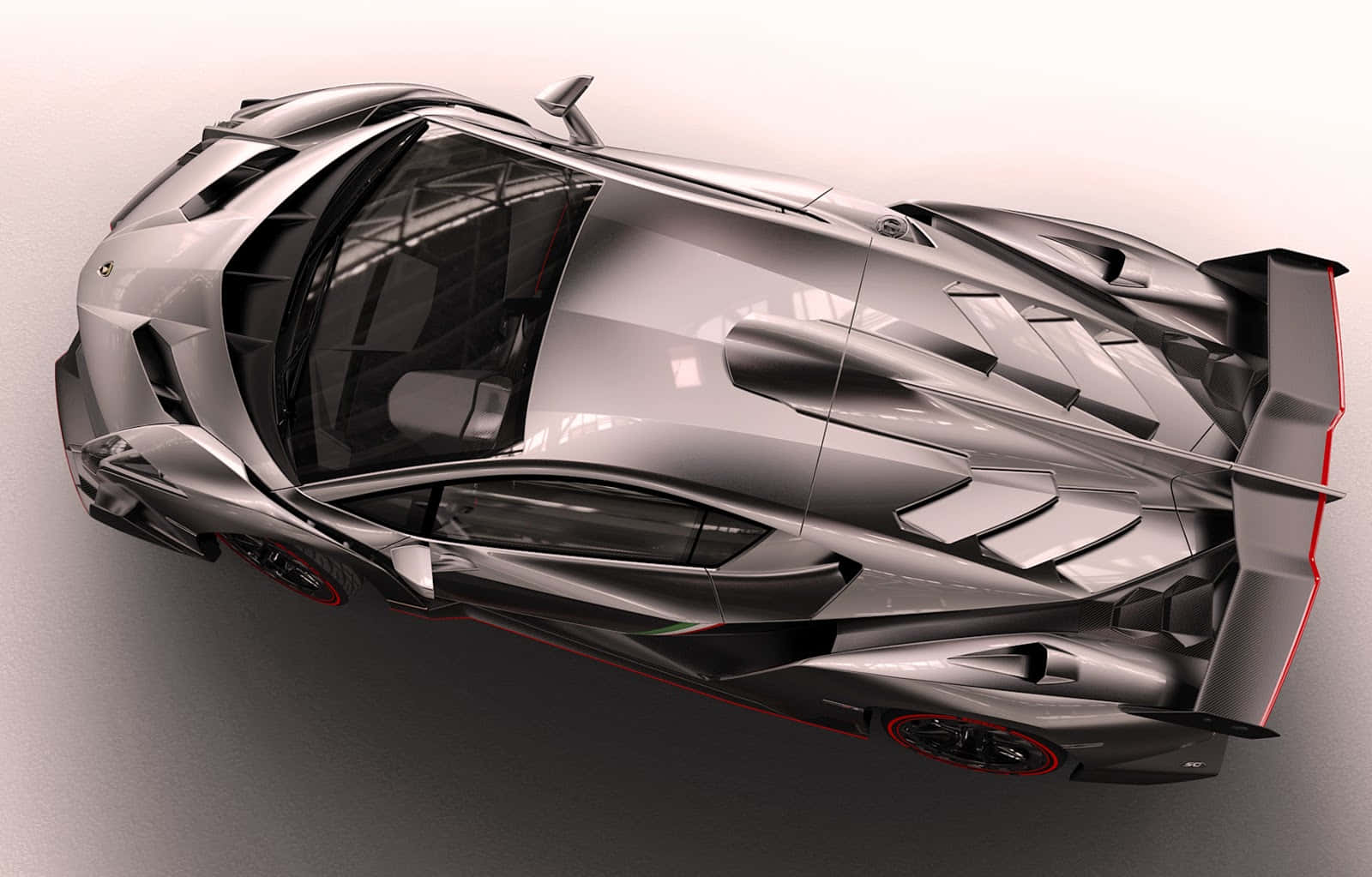 Lamborghini Veneno 桌布 壁紙 — 從上方俯瞰，一輛帶有紅色點綴的時尚銀色跑車，背景為簡約的工作室風格。