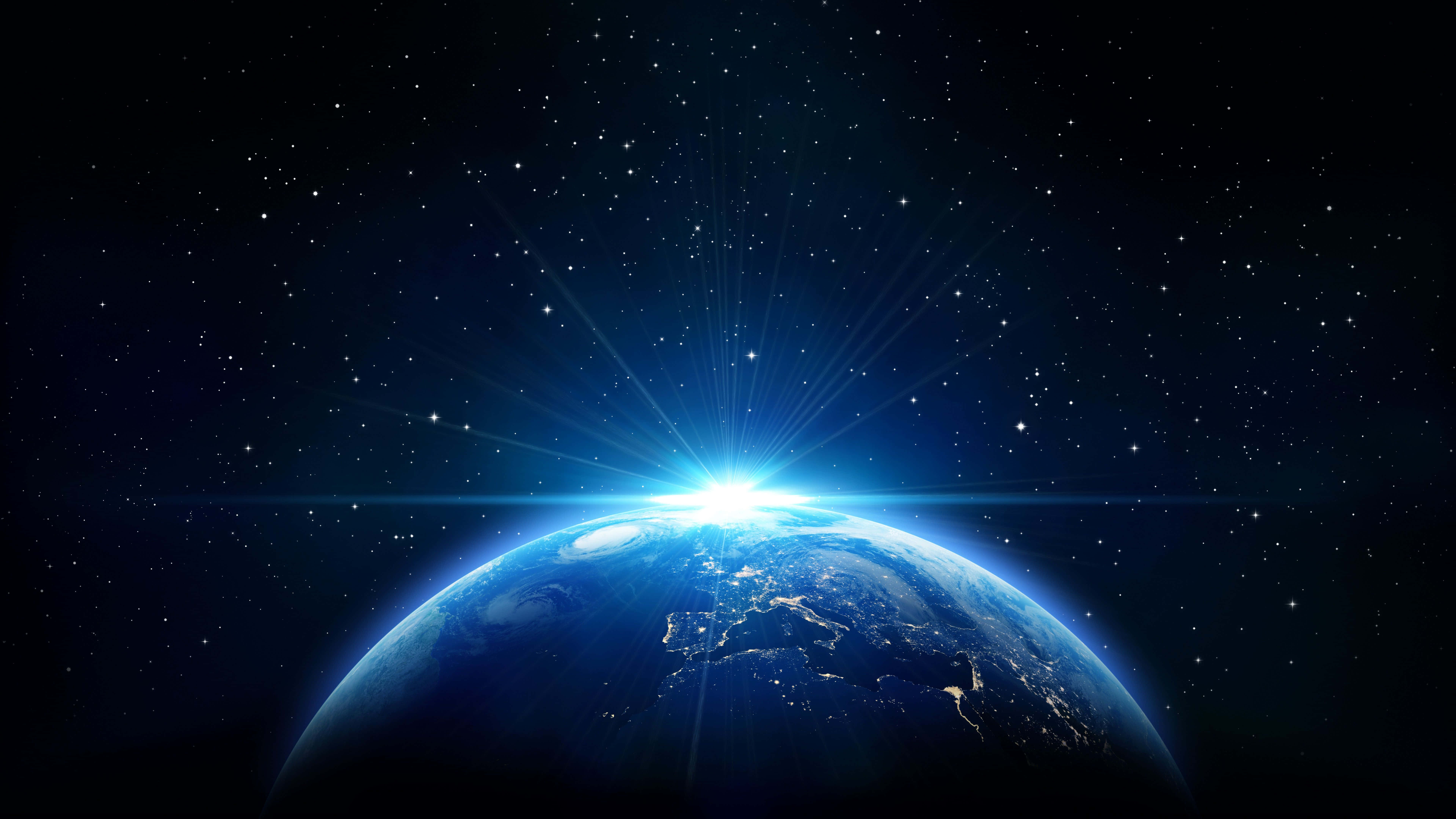 Earth Science 桌布 壁紙 — 從太空俯瞰地球的壯麗景色，燦爛的日出在繁星點點的宇宙中劃破彎曲的地平線。