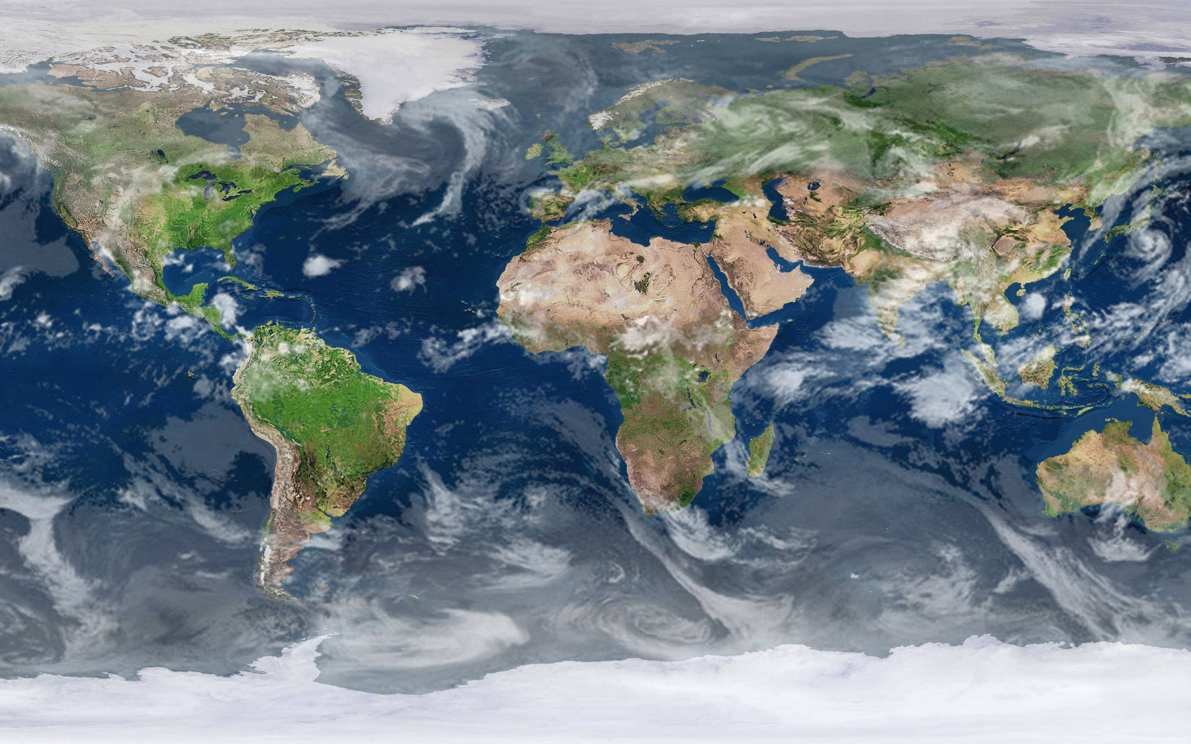 世界地圖 桌布 壁紙 — 從太空俯瞰地球的鳥瞰圖，清晰顯示大陸、海洋和旋轉的雲層。