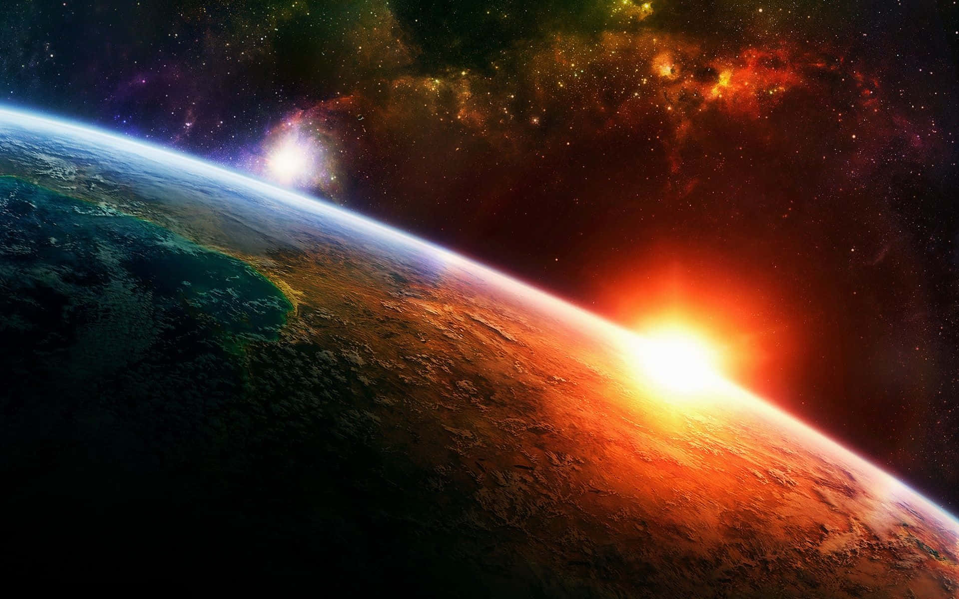 Colorful Space 桌布 壁紙 — 從太空欣賞地球在日出時的壯麗景色，鮮豔的橙色光芒照亮了彎曲的地平線，背景是繁星點點的宇宙。