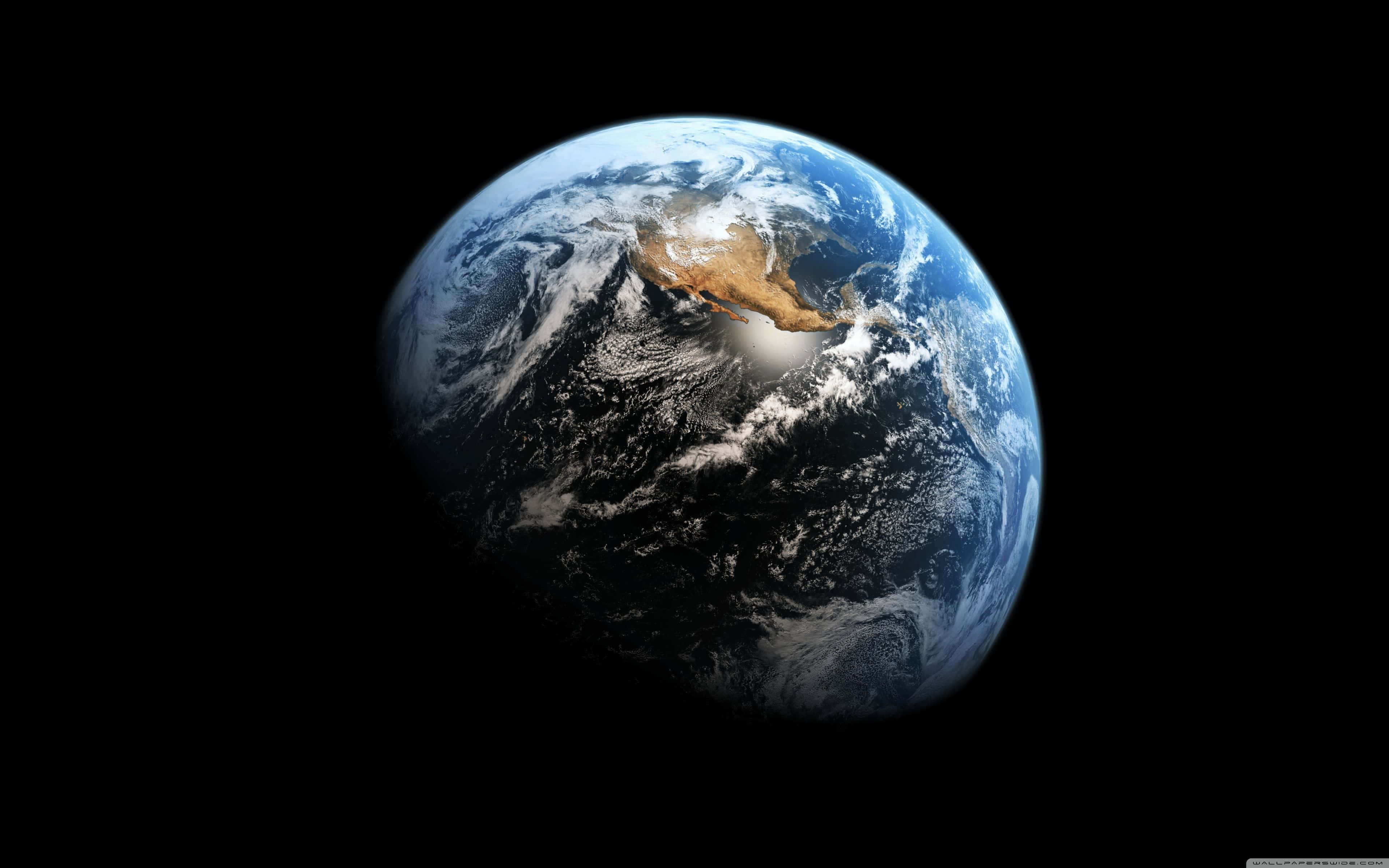 從太空看地球 壁紙 — 從太空俯瞰地球的壯麗景色，展現藍色海洋、白色雲層和棕色陸地，背景是太空的黑色虛空。