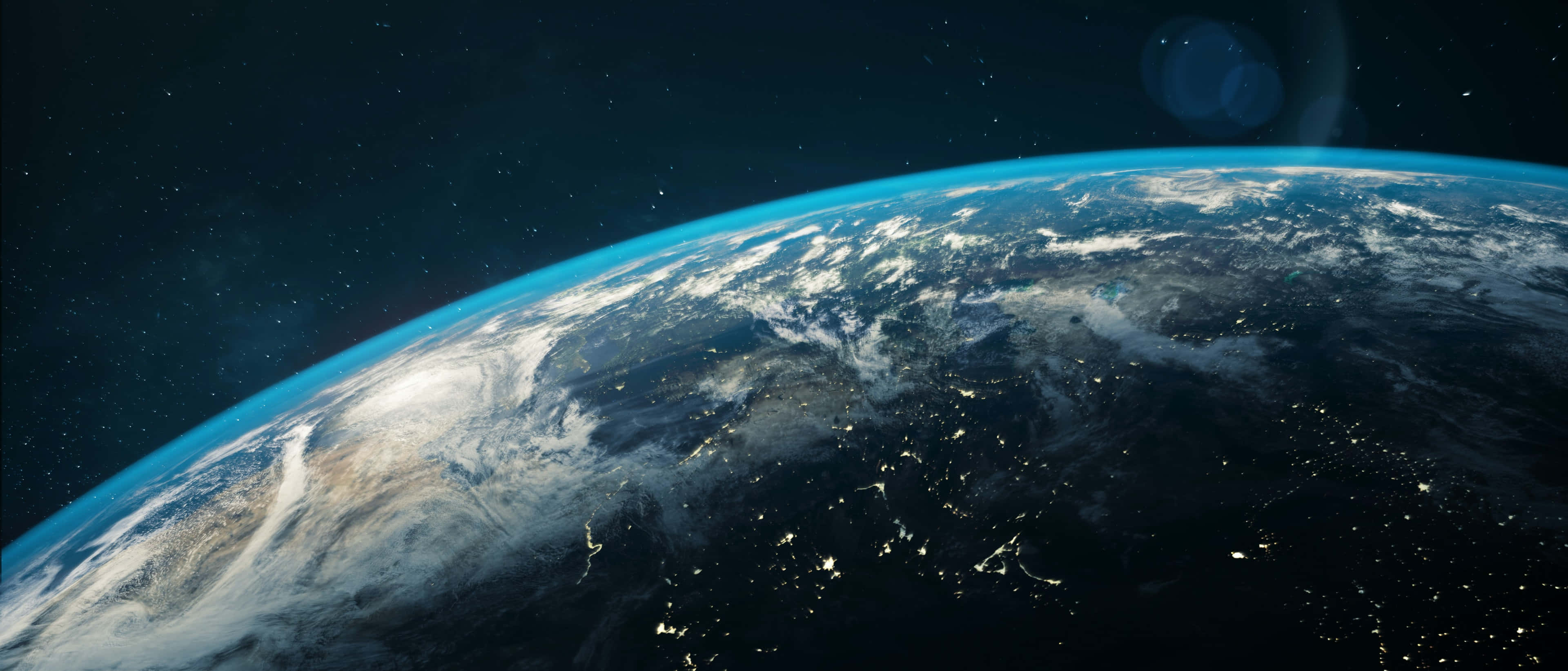 World 桌布 壁紙 — 從太空觀看地球，城市燈光閃爍，雲層旋轉，背景是繁星點點的黑色天空。