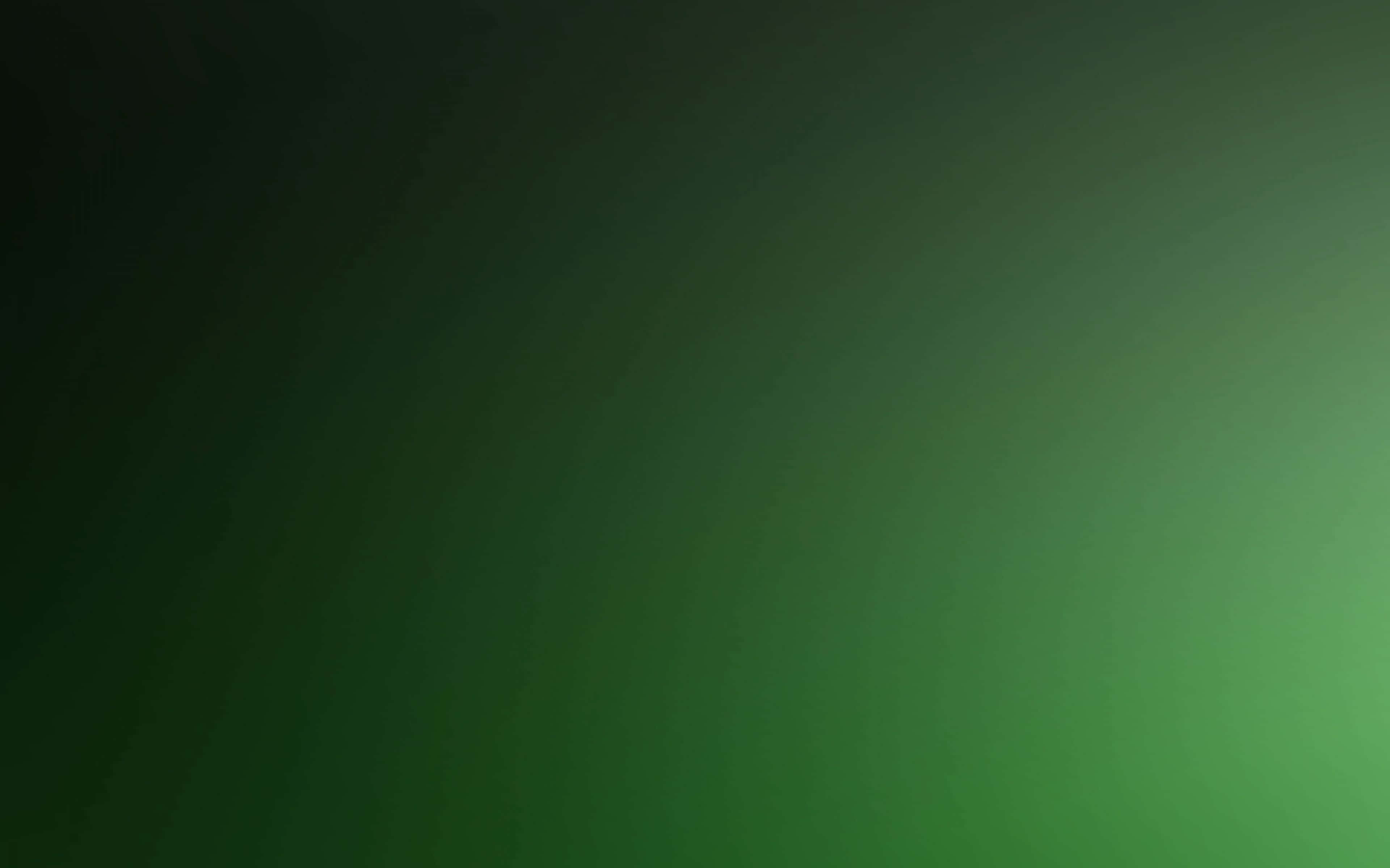 Black And Green 桌布 壁紙 — 從深綠到亮綠的平滑漸變，帶有柔和的徑向光過渡。