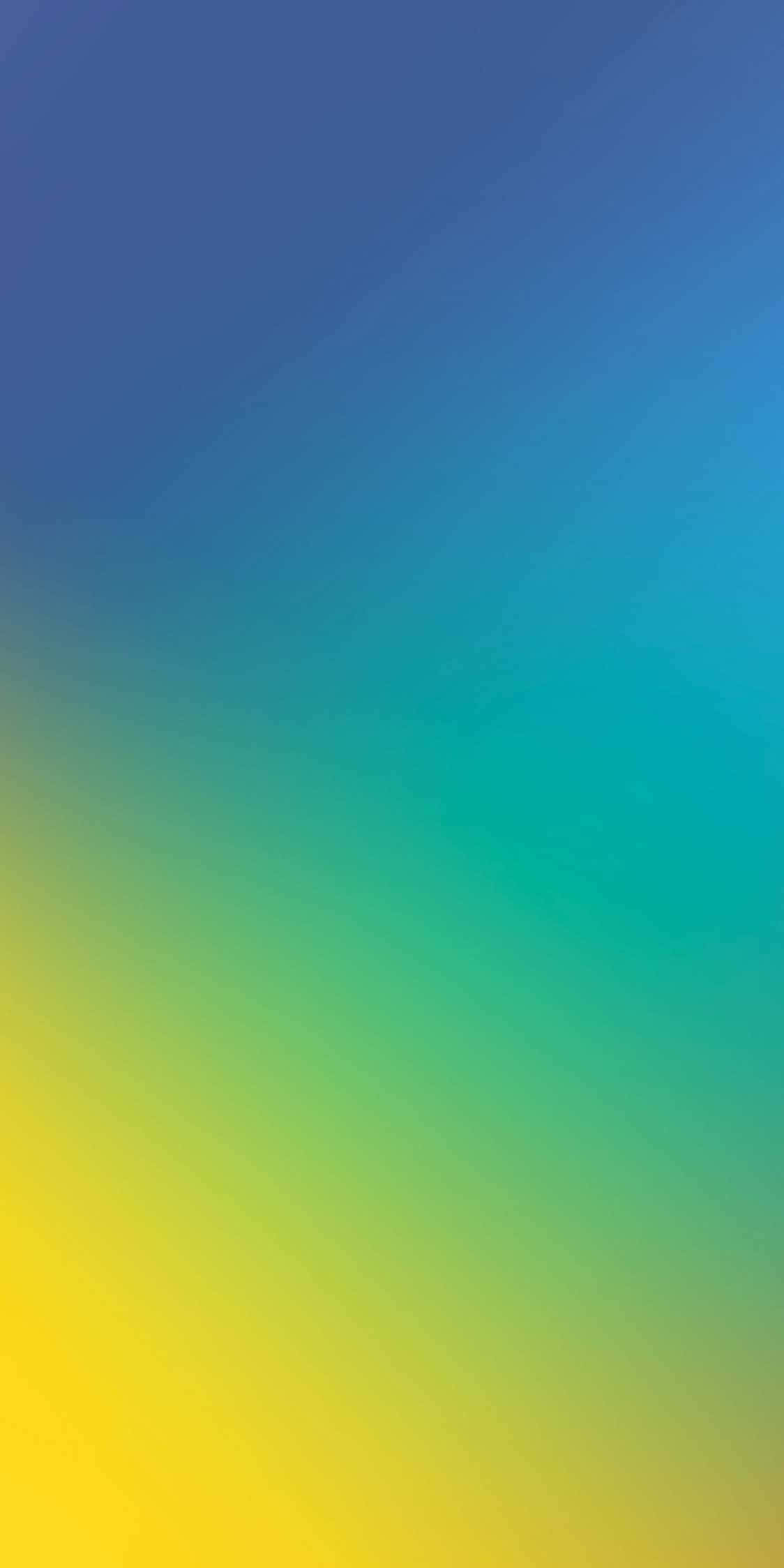 Yellow Gradient 桌布 壁紙 — 從深藍色過渡到鮮黃色的平滑漸變牆紙，帶有柔和的對角筆觸紋理。