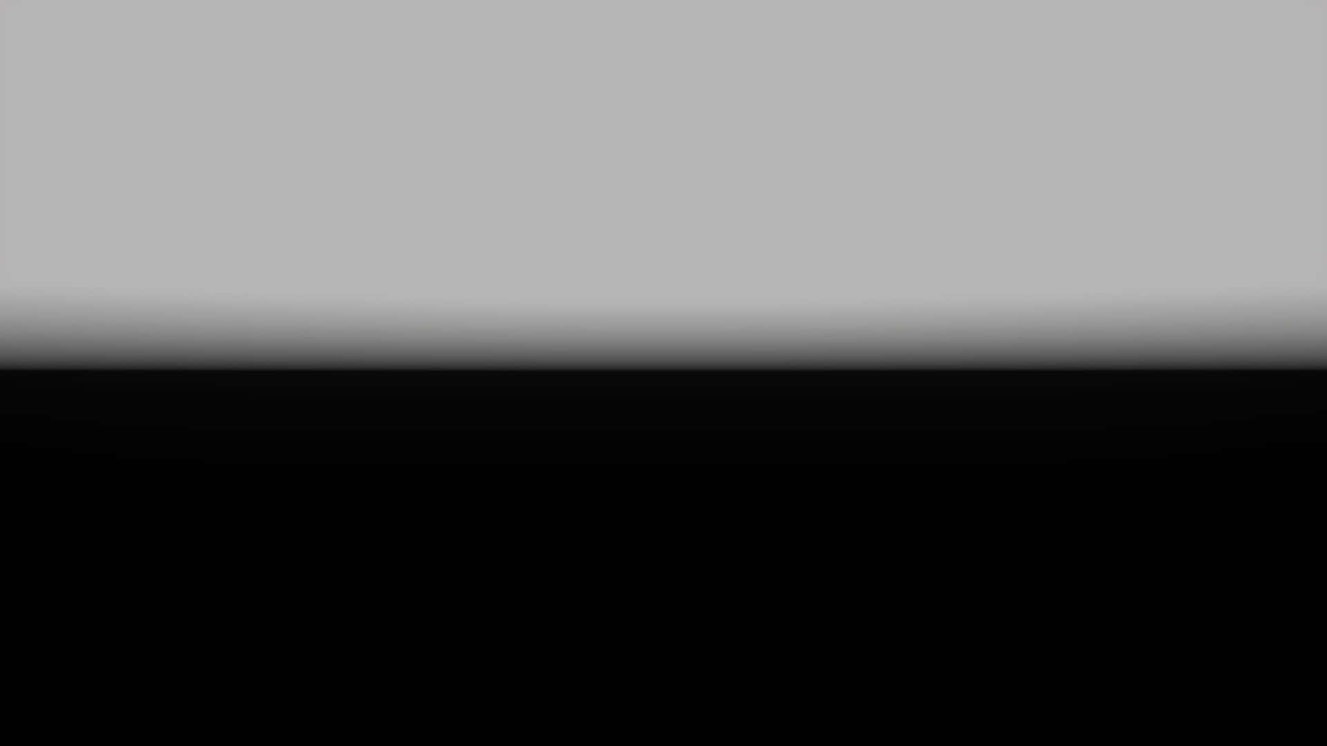 Half Black Half White 桌布 壁紙 — 從淺灰色到深黑色的極簡漸變，帶有柔和模糊邊緣。