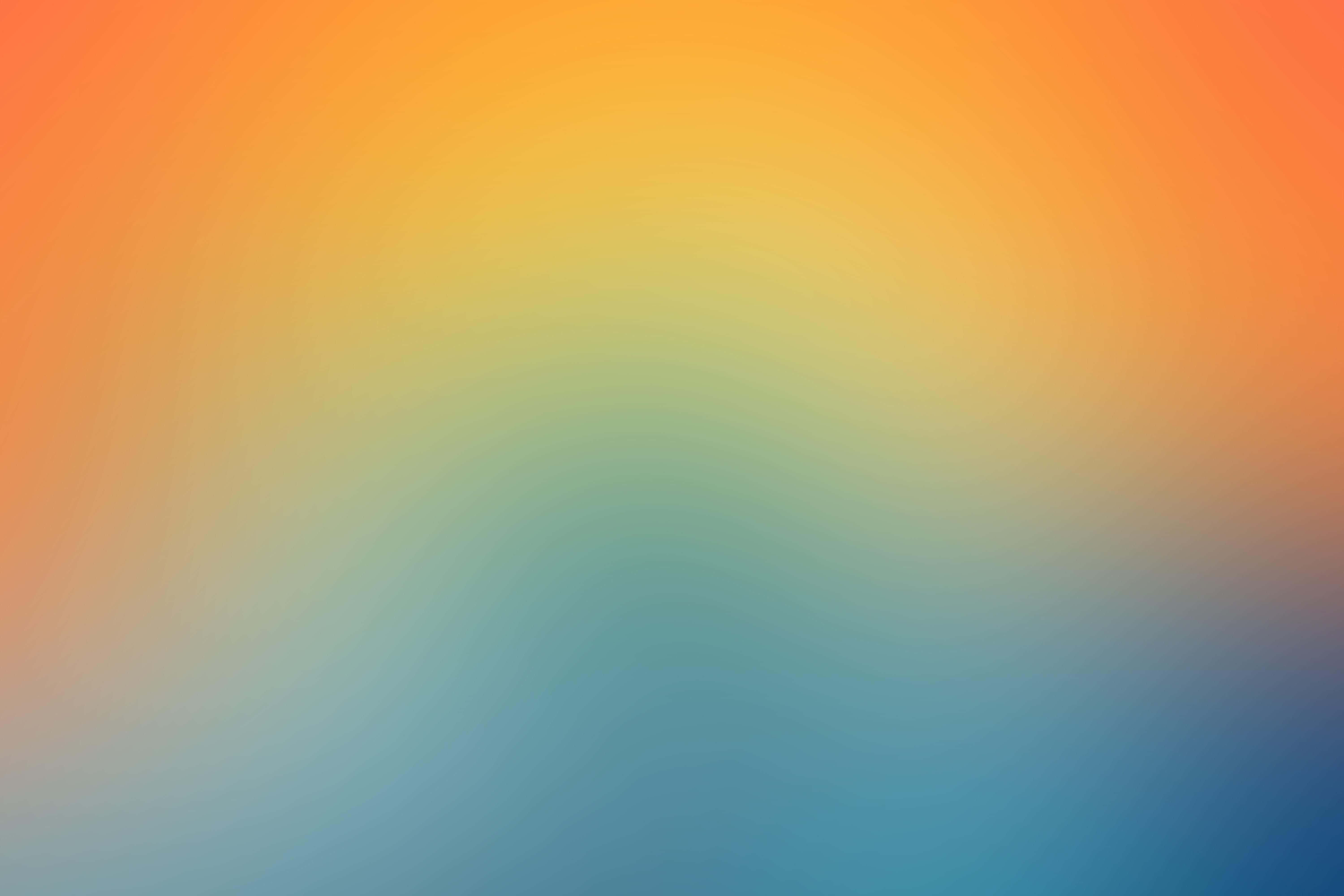 Yellow Gradient 桌布 壁紙 — 從溫暖的橙色到清涼的藍色平滑過渡，帶有柔和波浪圖案。
