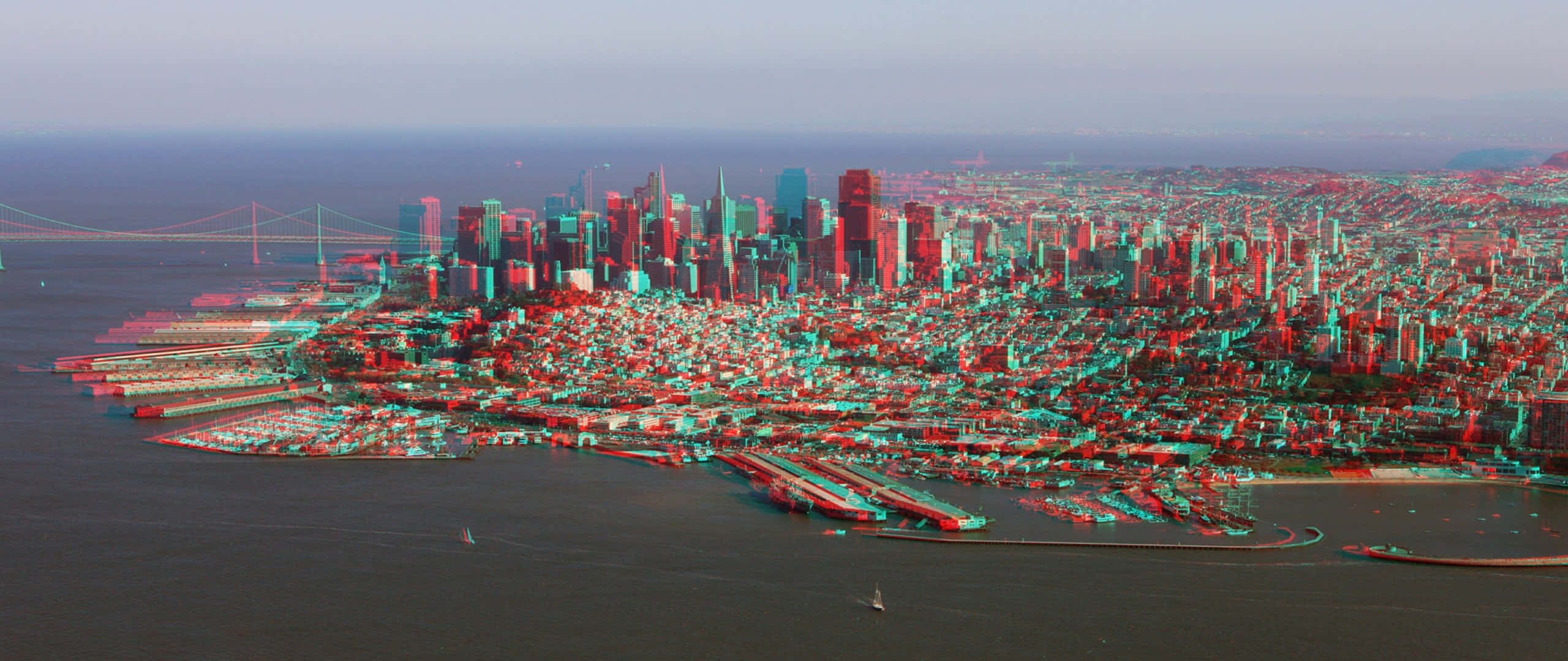 3d City 桌布 壁紙 — 從高空俯瞰廣闊的城市景觀，摩天大樓和海濱碼頭沐浴在超現實的紅色和藍綠色調中。