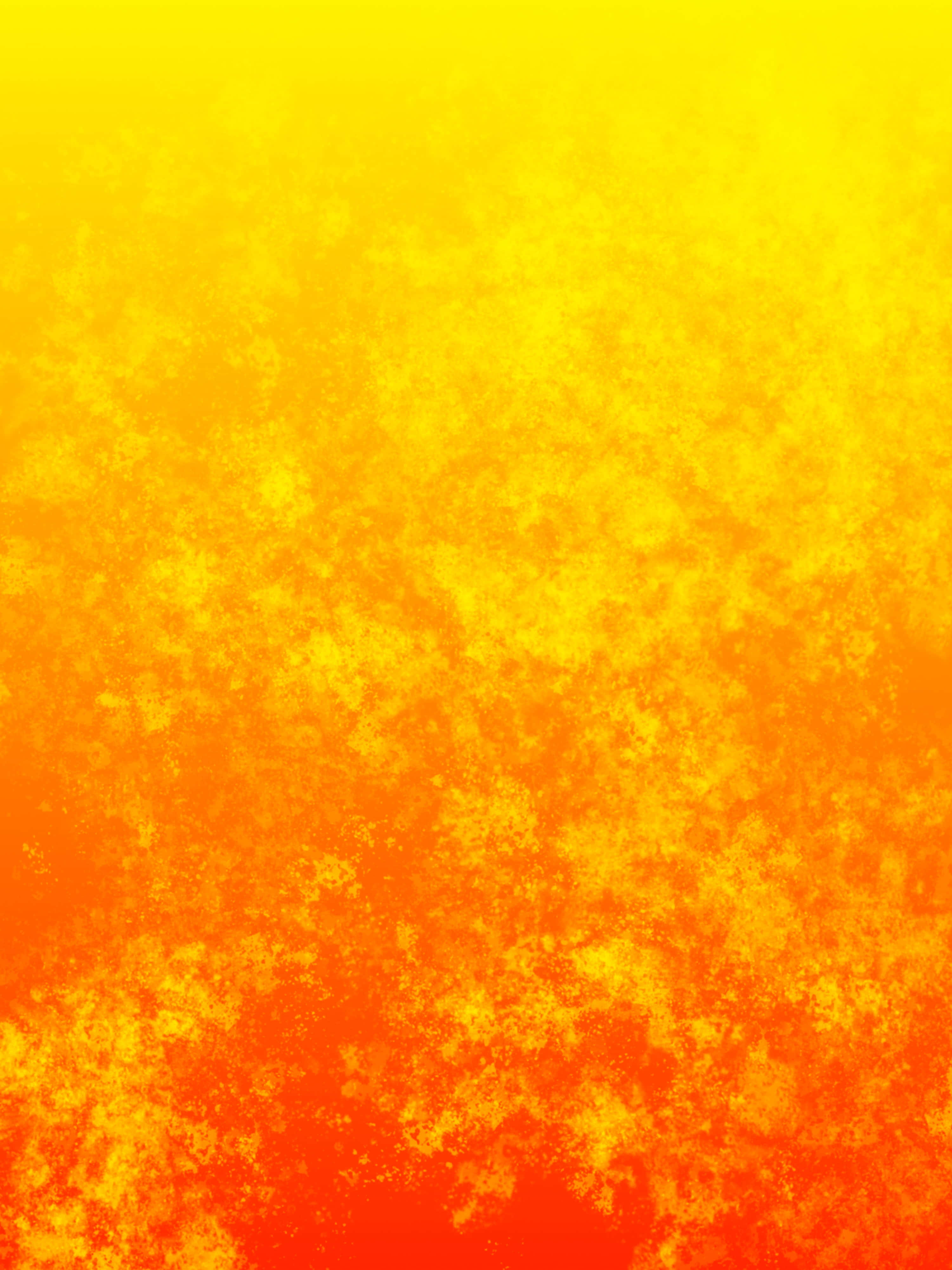 Yellow Gradient 桌布 壁紙 — 從黃色到橙色的鮮豔漸變，帶有紋理斑點，類似熾熱的日落或熔岩。
