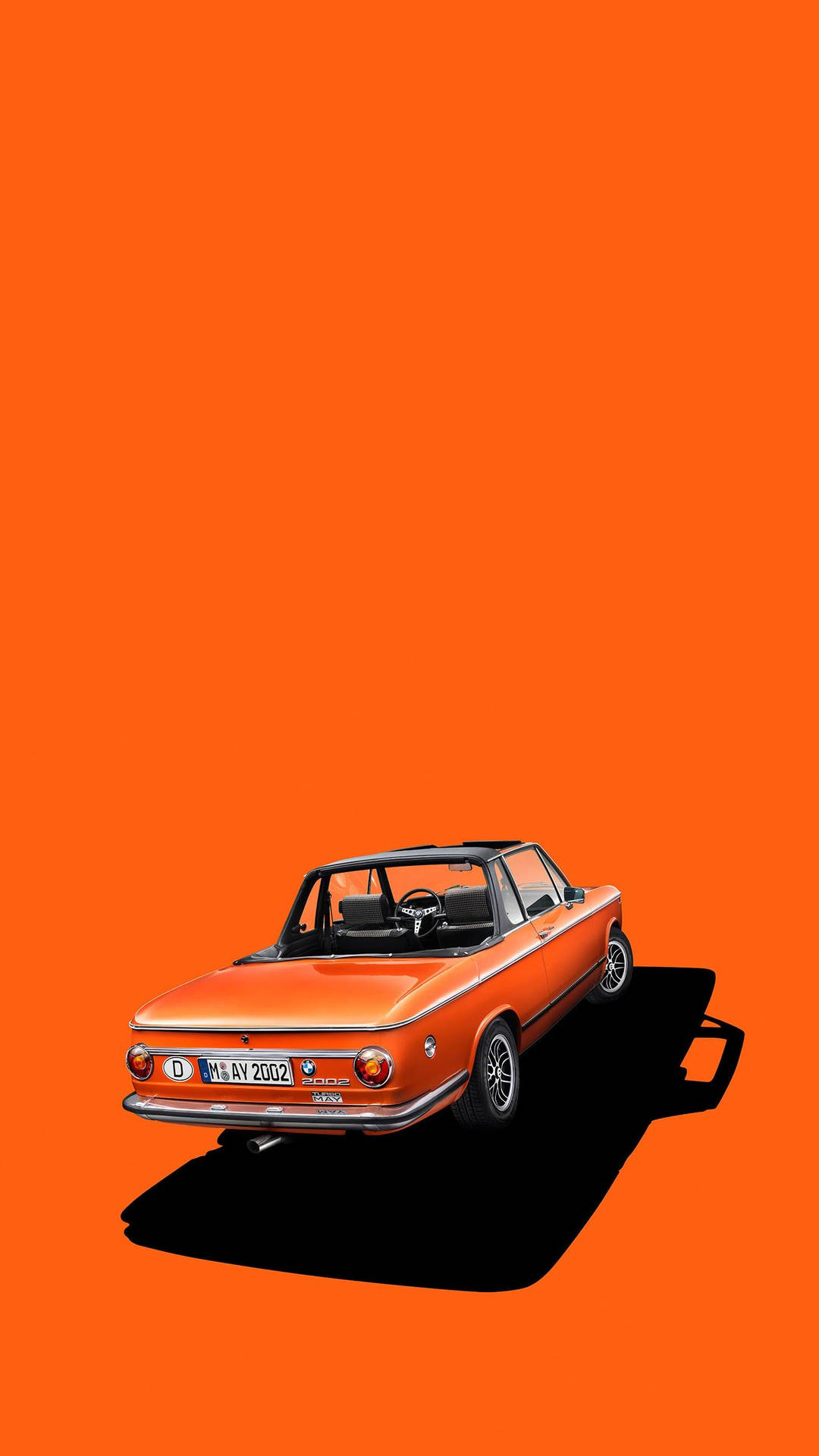 橙色復古開篷車，橙色背景上帶黑色陰影。